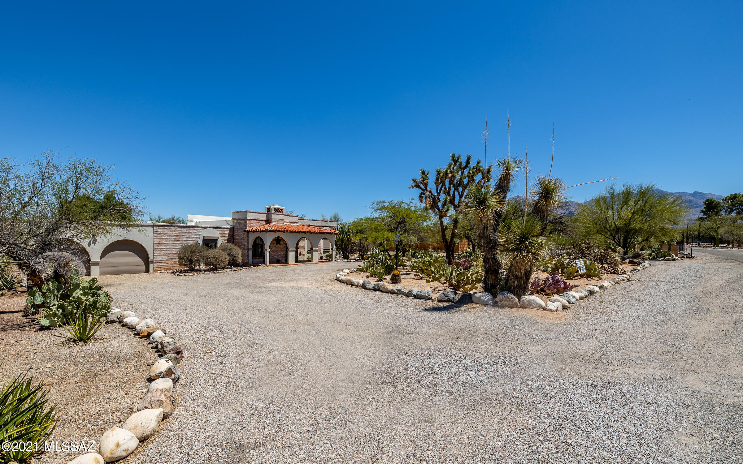 This isn't a dream, although it shows like one!! On nearly an acre w/Catalina Mtn views, private sanctuary meets convenient location! Home boasts: NO HOA, backs to a wash, mature vegetation, plenty of guest parking, BRAND NEW swimming pool w/ a backyard paradise of fresh landscaping rock, turf, walkways, private wall, custom gate, 2 sheds, newly recoated roof, rolling security shutters, stunning front door, exposed beam ceilings throughout, no carpeting, exposed block throughout interior, oversized bedrooms, enormous owners closet w/built-in organizers, wood burning fireplace, pre-wired surround sound, dual pane windows, laundry & mud room, washer & dryer included, kitchen w/ huge island, granite, pendant lighting, SS appliances, gas cooktop, wine fridge...WATCH VIDEO & READ FEATURE LIST!!