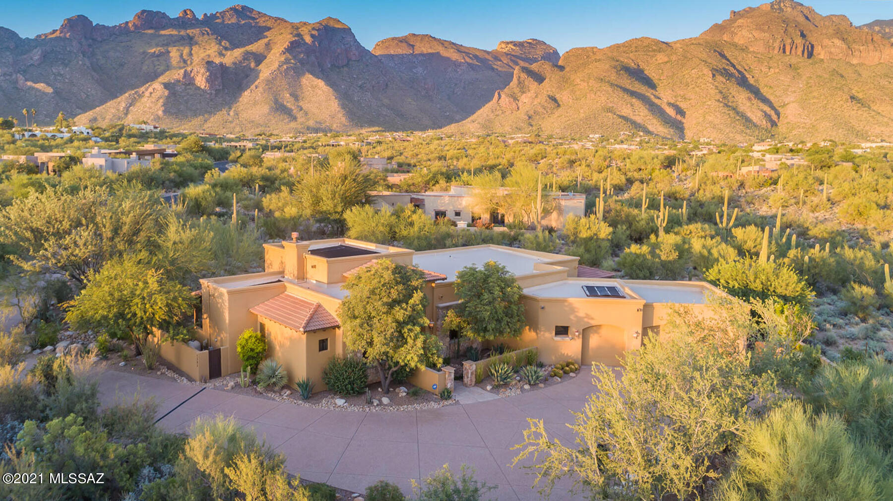 Luxurious 4BD/3BA (3,472 sf) home on 
private 1+ acre lot in gated Pima Canyon Estates boasts elegant detail & spectacular Catalina Mountain views! Spacious floorplan w/high ceilings and stylish design. Chef's dream kitchen hosts wraparound granite countertops w/cherry cabinetry, pull-out shelving, double oven & butler's pantry. Elegant over-sized Master suite w/bonus room hosts walk-in closet w/built-in shelving, luxury bath w/dual vanity, jetted soaking tub & walk-in shower w/massagers and 2 showerheads! Beautiful pull-out wood shutters adorn the multitude of windows. Loads of storage both inside and out. Entire lot beautifully landscaped resort-style, featuring solar-heated pool, striking foliage & fruit trees. With numerous top-of-the-line upgrades, this home screams Resort Living!
