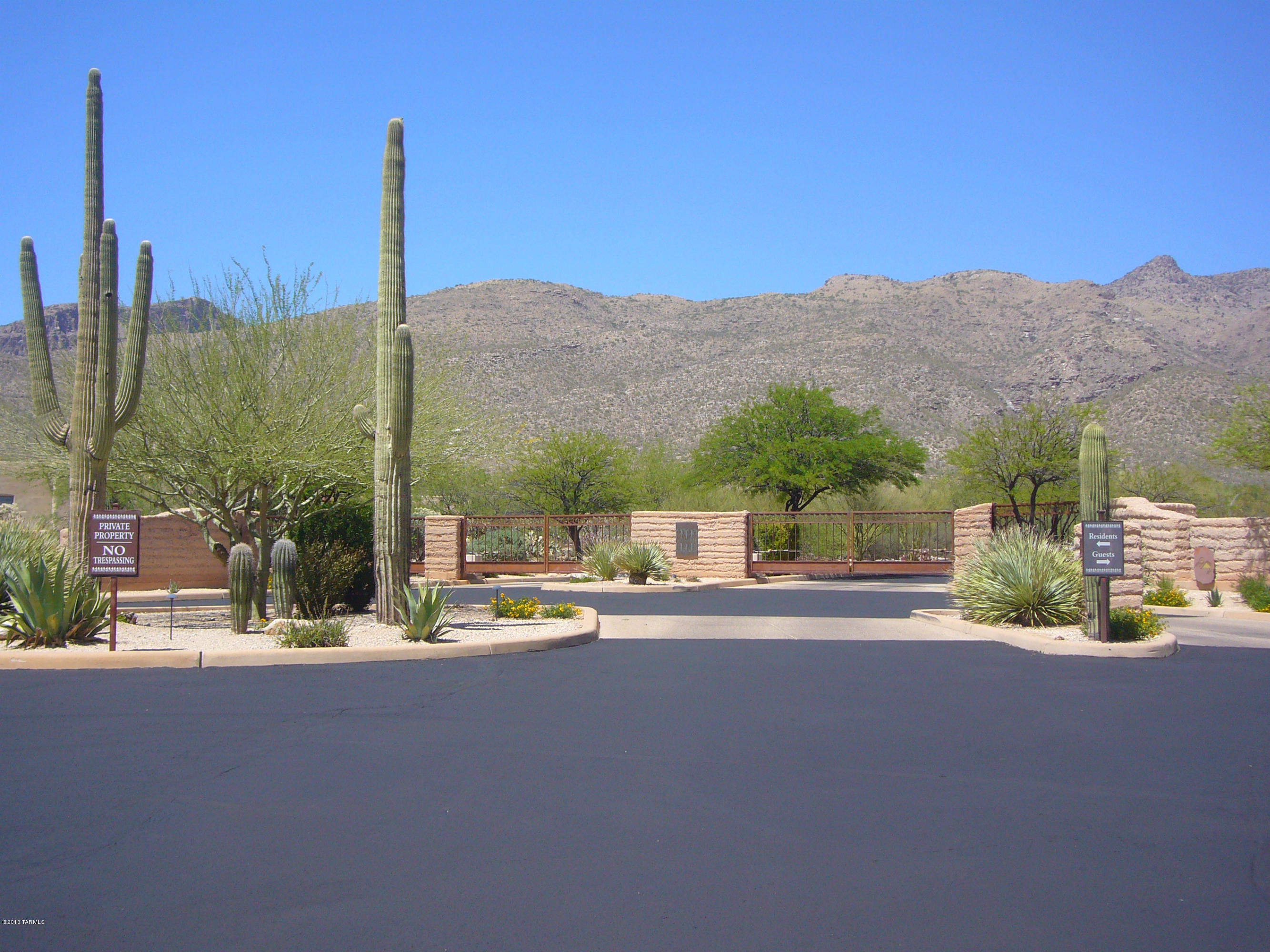 One of just a few remaining prime 3.3 acre lots in the premier gated community of Saguaro Hills Estates, an upscale 60 lot subdivison in the Tanque Verde Valley near Snyder/Houghton.  Gated but simple with no golf course, no guard.....just peace and quiet in a private pristine setting surrounded by mother nature.  Studded with saguaros, palo verde and mesquite in a riparian area full of birds and desert animals.  Panoramic views of the Catalina Mountains and east to the Rincon Mountians.  Paved streets and all utilities including sewer are at the lot line on this flat easy to build lot.  Lets get started building the luxury home of your dreams in this beautiful $1 million plus community!
