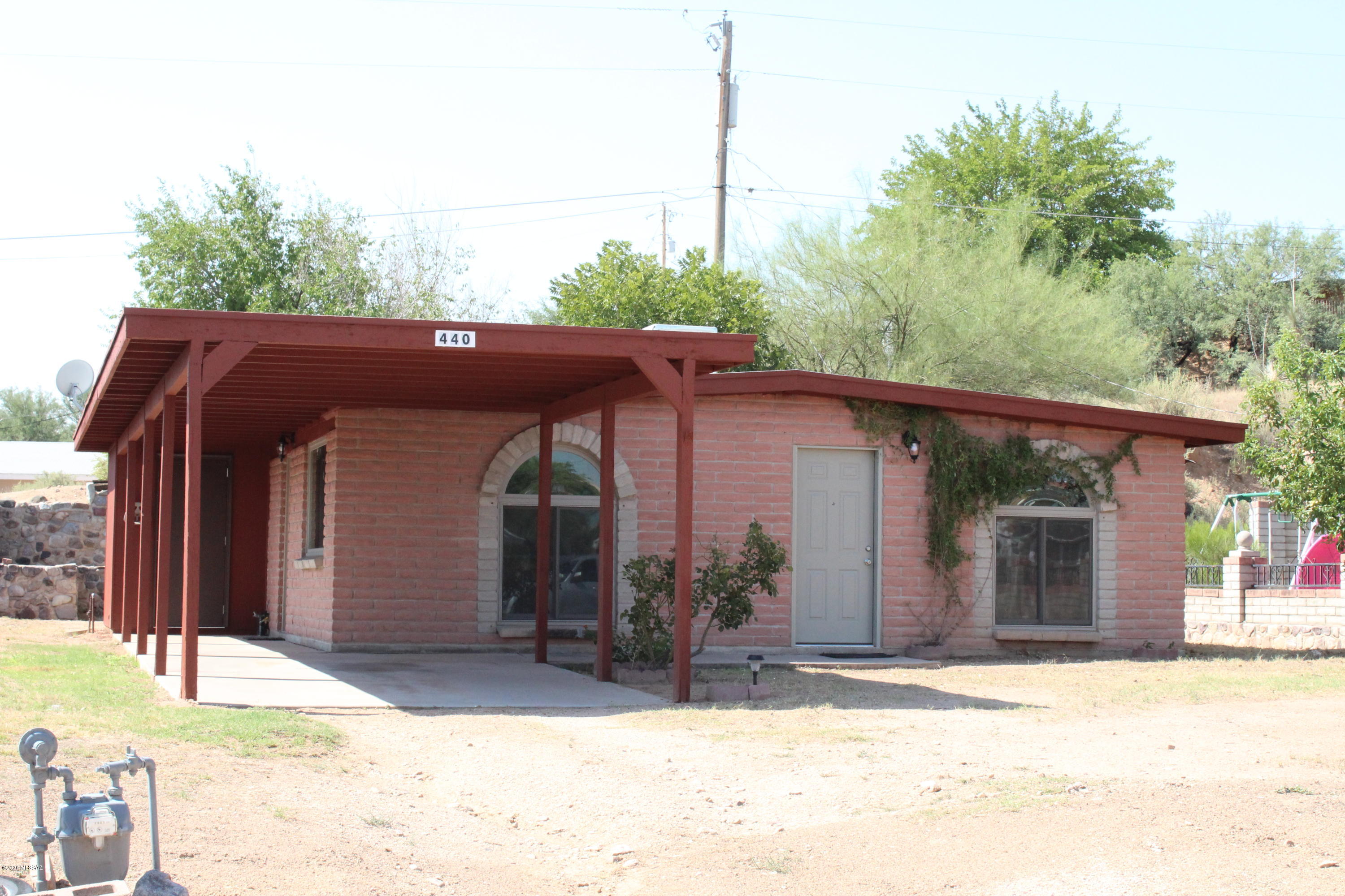 Cute and Cozy! Remodeled 3 bedroom 2 Bathroom home. This home features upgraded kitchen cabinets and countertops. Tile flooring flows throughout the home for easy cleaning and durability. All windows have been replaced with high quality dual pane windows! the home has a nice sturdy carport to protect your vehicle from the elements! The backyard features nice mature trees and a custom rock wall for privacy! Located in town close to shopping and restaurants.