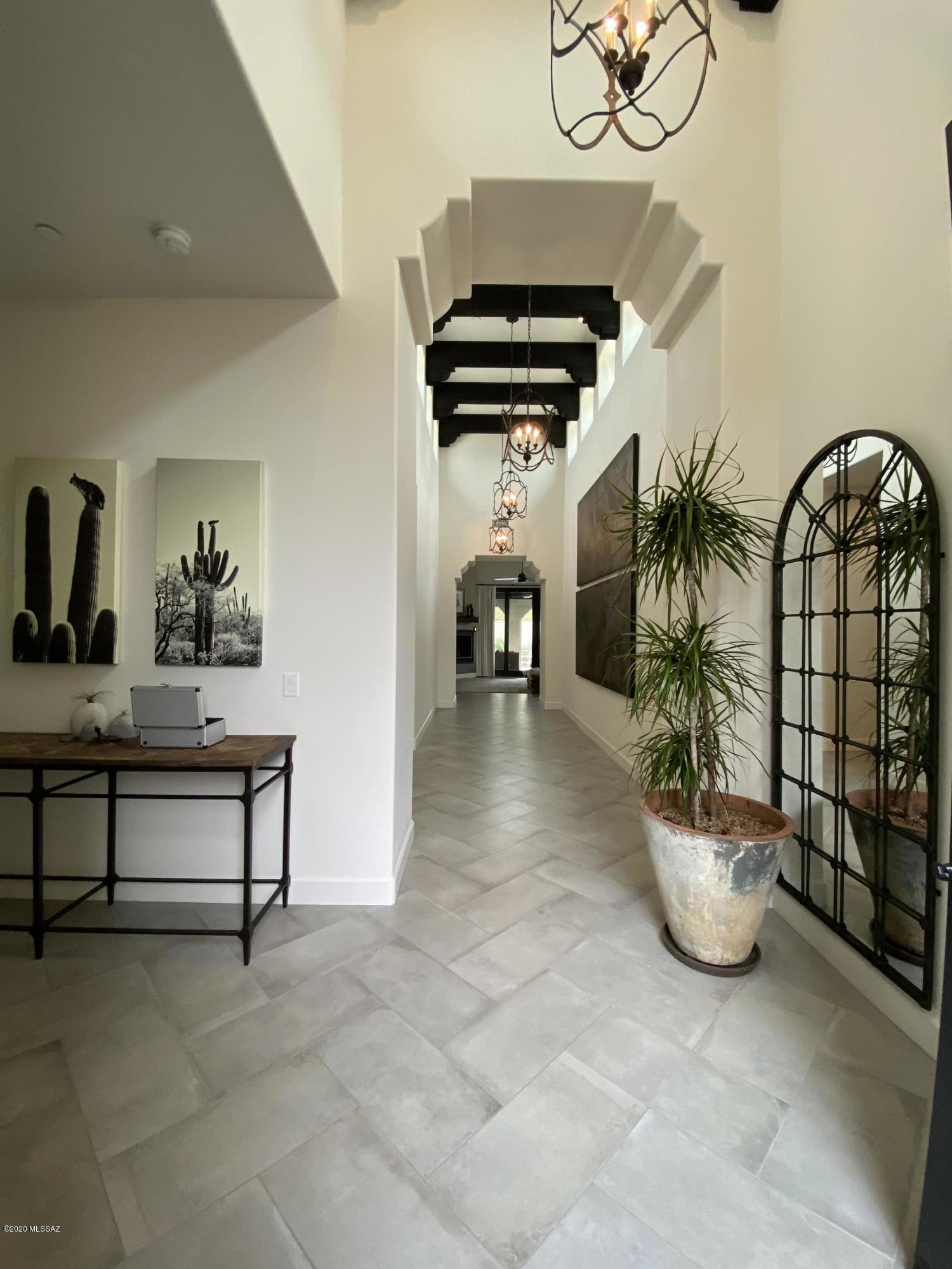 Welcome to casa Seton.A desirable community of 11 Spanish colonial homes near the Arizona Inn.Designed by EXA architects and crafted by Miramonte homes.Beyond the grand entrance w/ charming courtyard welcomes you dramatic wood-beamed ceilings and beautiful arched doorways.This home was built with an emphasis on pure,clean,natural light perfect for showcasing your art collection.The gourmet luxury kitchen opens to the great room and multiple covered patios where you can host and entertain your loved ones.Enjoy the best indoor/outdoor living w/ landscape architect designed yard w/ built-in BBQ,prep sink,hanging heaters,gas fire pit,water fountain,garden beds,and a dog run. Blocks away from Banner hospital,The University of Arizona,Streetcar w/ easy access to 4th Ave,Downtown and The Mercado.