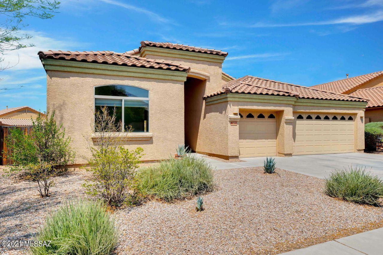 Foyer welcomes you to this Lennar Everest home!  Large living & dining area with patio access.  Spacious kitchen with granite counters, breakfast bar, family dining area, pantry closet, GE Profile gas range, GE Advantium microwave range hood, pullouts, R/O system. Family living area off kitchen.  Roomy laundry. Secluded master suite with patio access, soaking tub, shower, large closet. Bedrooms 2, 3, 4 all feature sliding door closets and have access to hall bath with dual vanities. Covered & open patio spaces with Catalina Mountain views. New carpet. Neutral paint. Water softener loop. 3 car garage !