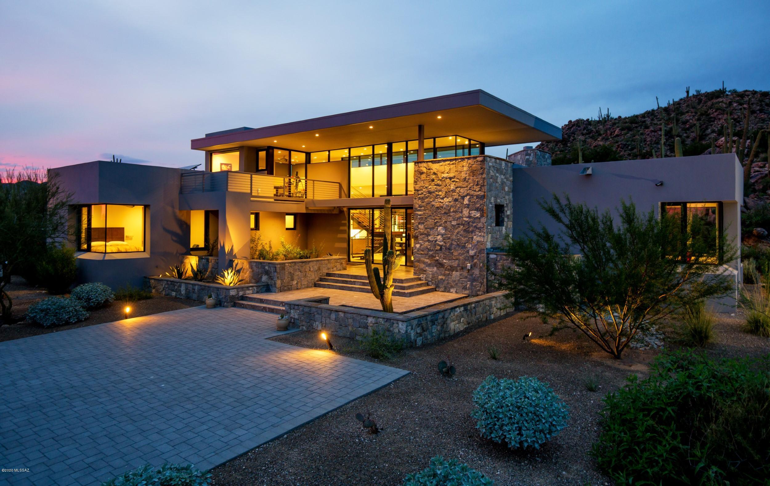 Award winning, one of a kind, Architect, Ron Robinette masterpiece, artistic, contemporary designed home. Perfectly nestled into spectacular Stone Canyon cul-de-sac lot. Unparalleled interior design by Lori Carroll & Associates combined with Master Builder, Tom Mancuso. Attention to detail creates a perfect blend of timeless materials. Telluride stone and steel construction, commercial grade walls of windows offering spectacular vistas from every room. Quality fixtures, finishes and top of the line Miele appliances, custom cabinetry and state of the art fixtures like Graff's ''Stealth'' faucet and Dornbracht shower system offer the highest level of sophistication for a modern, contemporary home. Fully automated lighting, music, security cameras, shades/window coverings and audio/video. Handcrafted 8' oak doors, LED lighting, tankless hot water system. Three-bay cooled garage, charging station for electric vehicles. Inviting covered patio overlooking dramatic outdoor pool/spa, fire feature and cantilevered grill. This is a unique opportunity to purchase a world-class home. Furniture is for sale as well.Occupied twice a year!