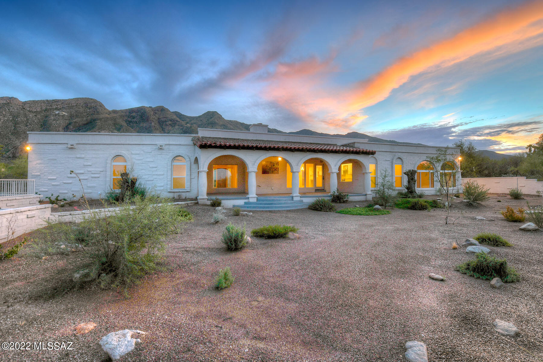 This tastefully remodeled, burnt adobe territorial home is nestled on a high lot in desirable Skyline Bel Air Estates and offers panoramic mountain & city views. Located on a quiet 1.21 acre cul-de-sac lot, this 3,012 sq. ft. home features a living room with arched windows & built-in shelving, a formal dining room, a family room with a beehive fireplace, an activity room with expansive arched windows, and a den/office that could be a 4th bedroom. The light & bright kitchen offers concrete counters, refinished cabinets and a breakfast area.  Additional highlights include brand new concrete-overlay flooring, wood laminate floors in bedrooms, freshly painted inside & out, all windows replaced in 2019, new two-zoned HVAC, two new water heaters in 2019, roof re-coated in 2021, all new interior doors, new lighting & plumbing fixtures, all new bath vanities, remodeled hall bath, freshly epoxied garage floor, new main water line, and updated plumbing & new main electrical panel. Enjoy the expansive covered back patio, a walled pool-size backyard and scenic city & mountain views. The front & backyards have been recently landscaped and offer resurfaced sidewalks and porches. Don't miss the SBA community center offering a pool, plus tennis & basketball courts. District #16 schools.