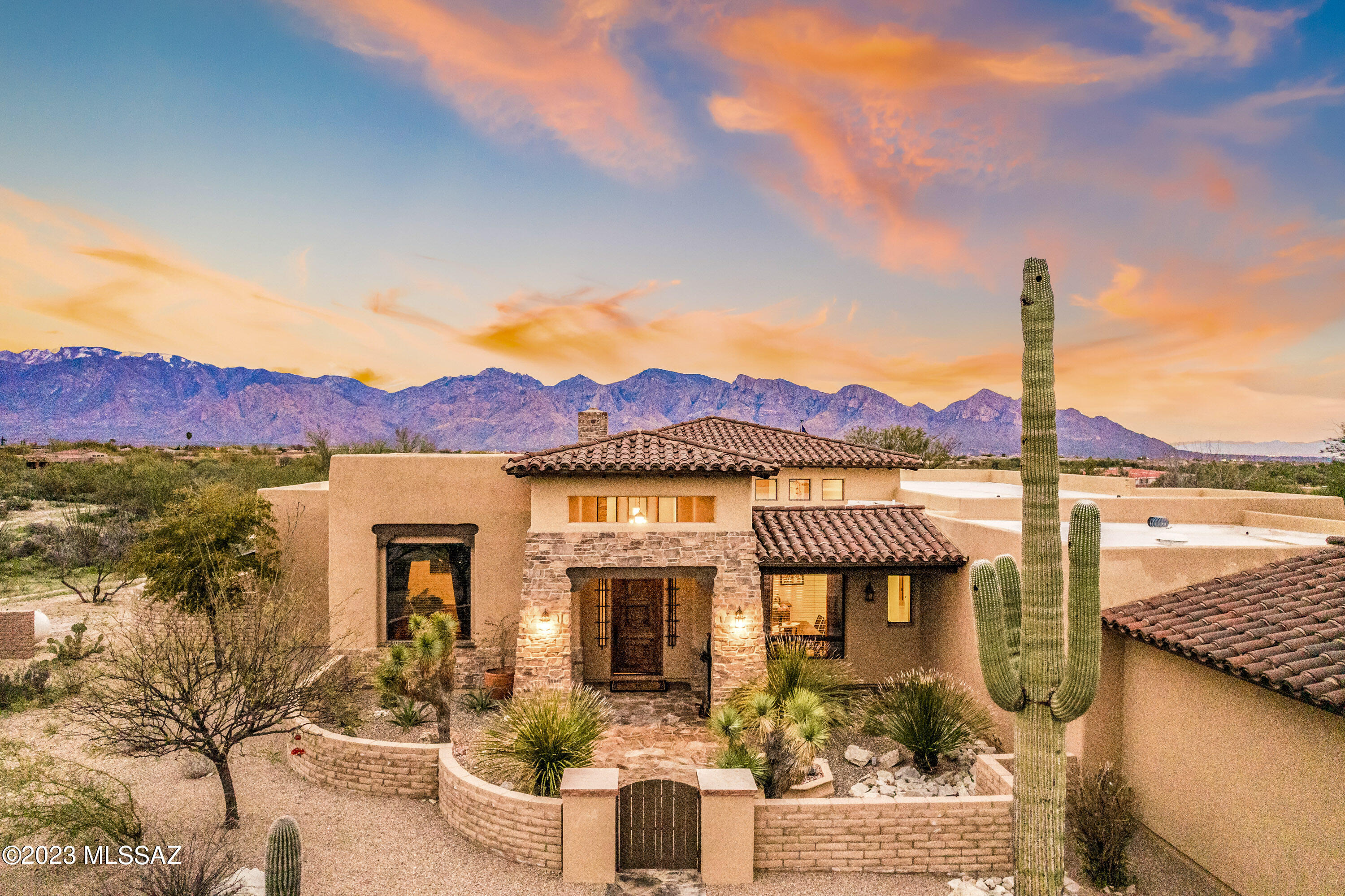 Located in the highly desirable La Cholla Airpark, this exquisite single story 3668 SF, 4BD,      5BTH custom built home is located on a pristine and ultra private 7.99 acre lot, with sprawling lush desert in all directions, high-end horse facilities, and breathtaking panoramic views of the Catalina mountains. Enter the property through the custom designed iron security gate, into the inviting and functional open split floor plan features travertine tile, appointed stone veneer walls, vaulted ceilings,  & multi-room audio. The spacious custom kitchen includes granite countertops, Alder wood cabinets and doors, SS appliances, six burner gas cooktop, wall mounted oven, and island peninsula with seating. The large primary ensuite offers ultimate privacy, w/ large walk-in shower, dual custom walk-in closets, access to the outdoor living space, and spectacular mountain views.  The wrap-around outdoor space is the perfect place for entertaining with friends and family, featuring a heated custom designed pebble-tec pool & Spa with beach entry, built-in gas BBQ and cook area, wood/gas burning fireplace, wood beam pergola, and newly resurfaced rock overlay patio floor.  A spacious 3-car garage and sealed driveway provide easy access and usability.

The property's horse facilities are nothing short of spectacular, with tack room, hay barn, hot water system for horse maintenance, covered breezeway, spacious horse runs, and fan-cooled individual stalls, all enclosed in steel pipe fencing.  An additional large horse arena, and secondary 3-car detached garage/workshop with half bathroom, provide additional options to accentuate the property.

Build your dream hanger and taxi your plane from your home to the private airstrip, where a 4500' long paved and lighted runway awaits your departure.

Stunning architecture, high-end finishes, and sweeping mountain views, make this a must-see property!