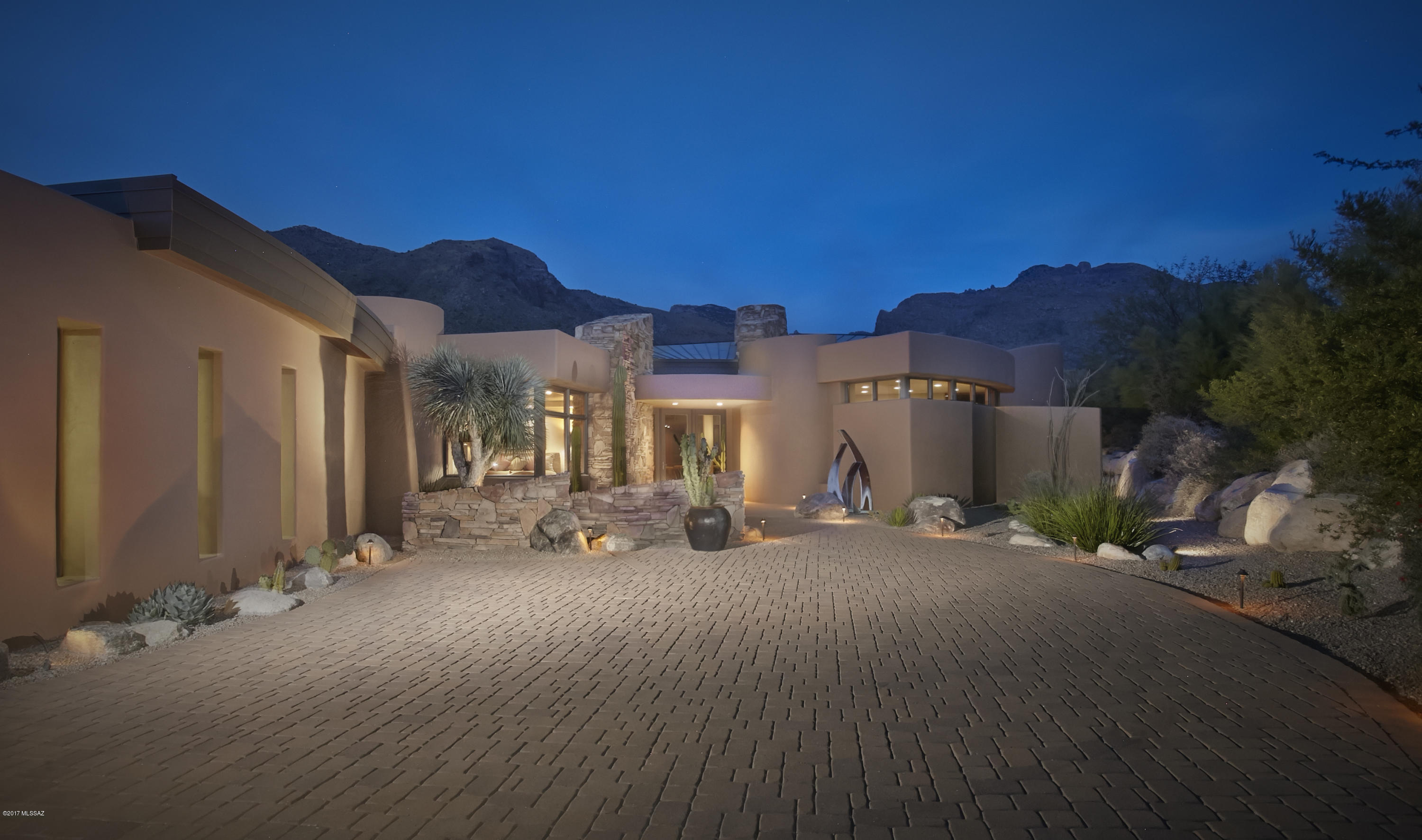 PREPARE TO BE AMAZED BY THIS SPECTACULAR 4BR/5BA KEVIN HOWARD MASTERPIECE.  IN THE SECONDARY GATES OF PIMA CANYON, IT IS SITED TO SHOWCASE THE CONTEMPORARY ARCHITECTURE WHILE CAPTURING THE BEAUTY OF THE MOUNTAINS & DESERT.   SOARING FLOOR-TO-CEILING WINDOWS FRAME THE CATALINAS.  THE OPEN FLOOR PLAN FLOWS SEAMLESSLY FROM THE GREAT ROOM TO THE KITCHEN & FAMILY ROOM.  GOURMET KITCHEN IS A CHEF'S DREAM W/ A DACOR RANGE, 2 FISHER & PAYKEL DISHWASHERS, GRANITE ISLAND AND MORE.  THE MASTER SUITE W/STONE FP BOASTS A HUGE CLOSET & SERENE SPA-LIKE BATH.  THREE GUEST SUITES WITH EN SUITE BATHS ARE IN A PRIVATE WING.  RESORT-STYLE BACKYARD W/STONE FIREPLACE & OUTDOOR KITCHEN IS IDEAL FOR ENJOYING THE BEST OF THE TUCSON LIFESTYLE. SEE THE DRONE VIDEO AND 3D WALKTHROUGH UNDER VIDEO AND VIRTUAL TOUR.