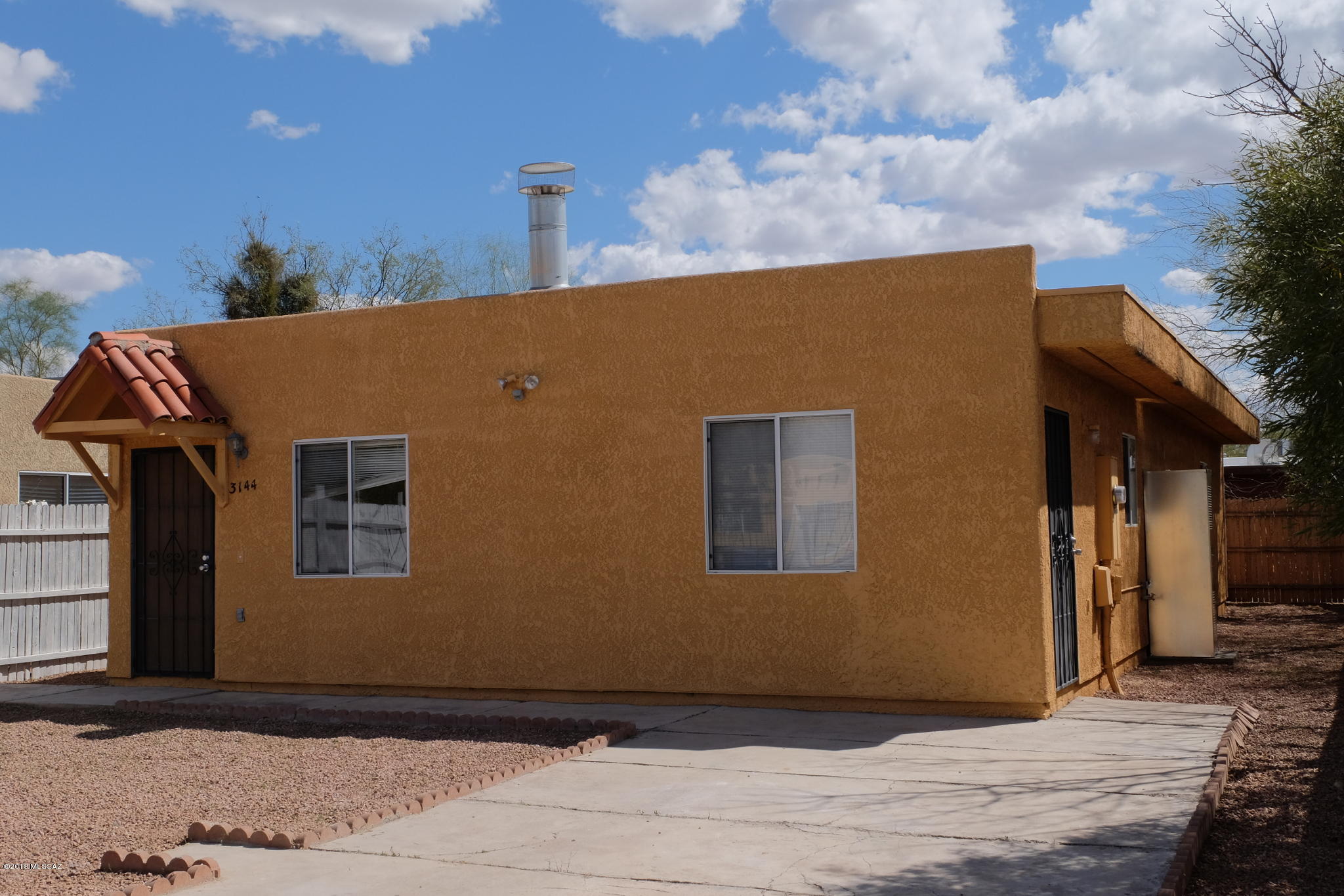 Single-story Newer Construction 3BR/2BA Home in Central Tucson. Updated interior is open and airy with no carpet and fireplace. Gated & fenced exterior provides privacy and safety. Located close to all area schools, shopping, parks, the UofA, and downtown. 12mo minimum Lease, $50/adult Application Fee, $1575 Security Deposit, $150/pet Pet Fee with approved pet, $300 cleaning fee. Tenant pays all utilities. 6 month Lease rate is $1800/mo.