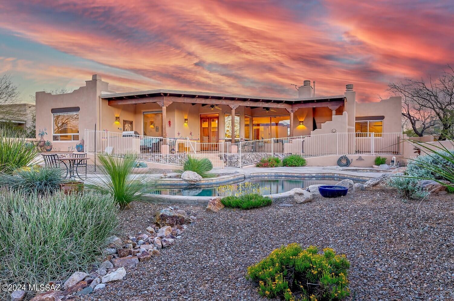 Amazing opportunity for updated 2,871 SqFt, 3 bed/3.5 bath plus den split floor plan, turnkey and meticulously maintained single story modern Santa Fe built in 1999, attached 835 SqFt finished 3 car garage, in-ground heated pebble tec pool w/granite waterfall and spa, on .84 acre RX1 private lot, awe-inspiring panoramic mountain views, located on whisper quiet private street with no thru traffic in desirable gated Bear Creek Estates in Northeast Tucson. 
N/S orientation, aggregate concrete semi-circle driveway provides ample parking, manicured landscaped front yard with mature saguaro cactus, native plants and vegetation on drip irrigation, hardwire landscape lighting, flagstone walking path, gated courtyard and covered front patio. Inside buyers will experience soaring cathedral ceilings, thick wood beams, genuine wood doors throughout, 8' Alderwood front door, energy efficient double pane windows throughout, new custom blinds, diagonal tile, recessed lighting, 7 skylights, 3 solar tubes, zoned gas HVAC featuring 2018 Train unit, digital thermostat, dual water heaters, wired for alarm, wired for surround sound, updated hardware/fixtures and internal laundry room with utility sink, storage, exhaust fan, 2020 Frigidaire steam stackable washer, dryer and stand up freezer included. Massive great room with large picture windows provide fantastic natural light and omnipresent Catalina mountain views, full slab granite wet bar area w/mini fridge, updated beehive wood burning fireplace (one of three fireplaces) w/gas starter and full slab granite hearth, adjacent to formal dining room, breakfast area and open concept kitchen. Luxurious entertainer's kitchen with full slab granite counter tops, granite bar w/bar seating, granite island, work station, updated wood kitchen cabinets with pull out bottom shelves, closet pantry, 2020 and 2021 black GE profile appliances, oven, warming drawer, Bosch dishwasher, dual metal undermount sinks, adjacent to den and freshly stained wood door out to private covered back patio. 
Experience multigenerational living at its finest, all three spacious bedrooms are complete with attached full bathrooms with full slab granite or Corian counters, modern wood executive height vanities and tiled walk-in showers. First guest bedroom could be used as home office with Off The Wall built-in solid wood work-station, bookshelves and desk. 
Marvelous primary bedroom with daily Catalina mountain views, privacy door out to covered patio, custom wood built-in dressers, gas beehive fireplace, colossal walk-in closet with California Closets built-in organizer w/soft close drawers and skylight. Stunning remodeled ensuite bathroom features: executive height full slab granite counter top, dual sink hickory vanity, rubbed oil bronze facets, spectacular tiled walk-in glass shower with multiple shower heads, separate soaking tub and updated water efficient Toto toilet. 
Attached 835 SqFt finished three car garage recently inspected and serviced by A1 Garage including new Wi-Fi garage door openers, springs, rollers, motors and panel in 2024 ($5,755 receipts attached). Featuring epoxy floors, utility sink, natural light, attached storage and work space. 
Enjoy tranquil Tucson nights from your North facing elevated covered extensive back patio with scored stained Monroe concrete flooring, wood beam pillars, custom painted wall murals, soaring wood beam ceilings, built-in bench seating, wood burning fireplace, plumbed for gas, built-in gas barbeque, additional seating area with pavers. Take in the unobstructed Catalina mountain views, as you walk down to the travertine tiled pool area, greeted by peaceful sounds from the custom granite rock waterfall, updated self-cleaning pebble tec heated pool and spa with dual drainage, pop-up cleaning system, new gas pool heater 2018 surrounded by custom metal view pool fencing. Metal gutter system with underground water diversion system, manicured landscaped backyard with Texas Mountain Laurel tree, cactus, desert plants, decorative rock, gated access and room for toys, pedestrian backwall gate with no direct neighbors, surrounded by masonry stucco privacy walls. 
Reasonable $425 annual HOA dues include gated community access with video surveillance, road maintenance, and metal mailbox.  Roof work completed March 2024 with transferrable warranty by West Coast roofing (see $7,962 receipt attached).
Great Northeast Tucson location close to Forty Niner Country Club Golf Course, Agua Caliente Regional Park, Arizona National Golf Course, hiking/biking/horseback riding trails and enjoy cool summers atop Mount Lemon.
Meticulous maintained, updated and move in ready for new owners to enjoy. Call to make your appointment to view this beautiful home today!