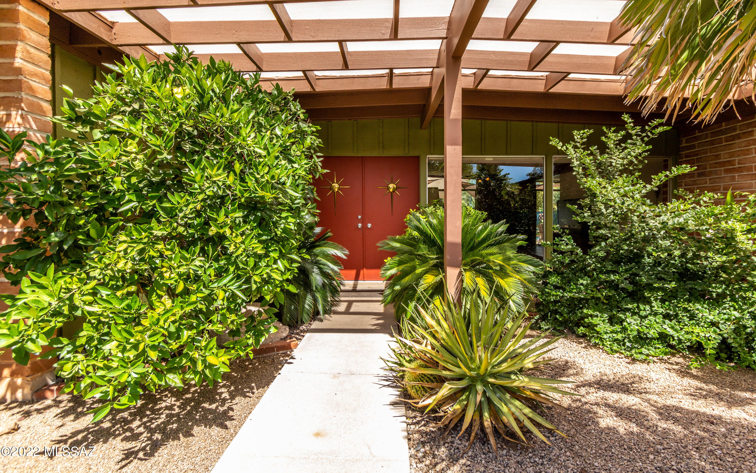 For those who appreciate great architecture, you'll love this fantastic midcentury modern home in Windsor Park that was featured in the Tucson Modernism Tour 2016.
Enjoy original features like the exposed burnt adobe, expansive floor to ceiling windows and sliding doors for indoor/outdoor living. The living room has beautiful views of the lush courtyard and pond. HVAC is 1 year old. New quartz kitchen counters.
This property includes a new, permitted 1 bedroom/1 bath guest house with concrete floors.
Imagine relaxing in the amazing backyard with a pool, covered patio and shade sails. 
This well-designed floorplan is great for entertaining small or large gatherings. See first-hand, why builder J. Herbert Oxman and Ambrose-Swanson Architects won the ''Best Home for the Money'' award-1963