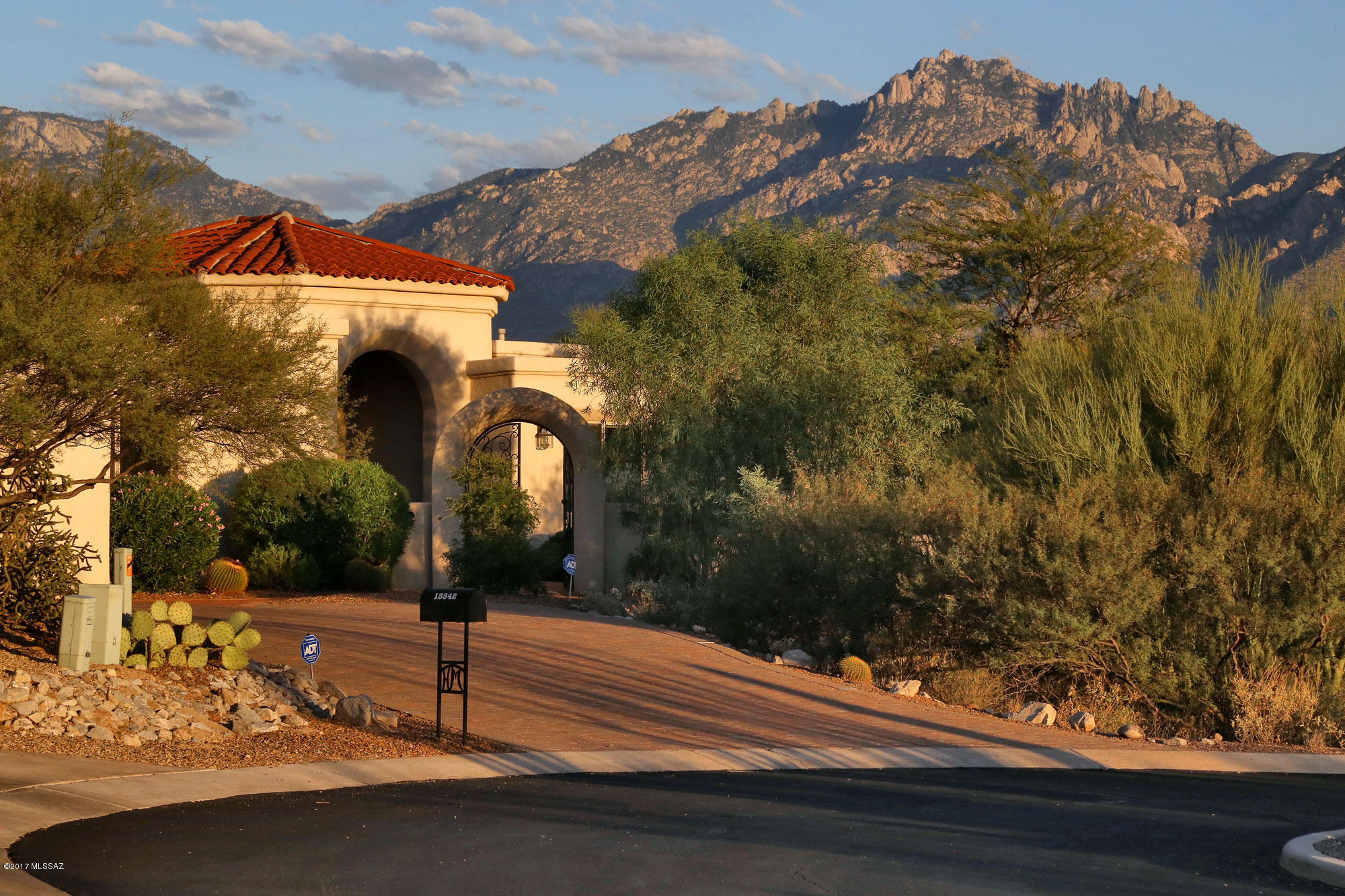 stunning Oro Valley Estate!!Well-appointed Mediterranean home located in the prestigious gated community of High Mesa.   Truly a floor plan that works for all, this split 4 bedroom plus den, 3 baths offers everything:  large open kitchen-family room concept, formal living/dining room, pool and spa, approximately 3,580 in living square footage and spectacular 180 degree mountain views from this very private .82 acre home site. Interior features include travertine floors, granite and travertine counter tops, stainless steel appliances, high ceilings, no interior steps, mature landscaping, brick paver driveway, zoned heating and cooling,   This home has been well maintained and is ready for immediate occupancy! 2-10 Home Warranty offered with purchase.