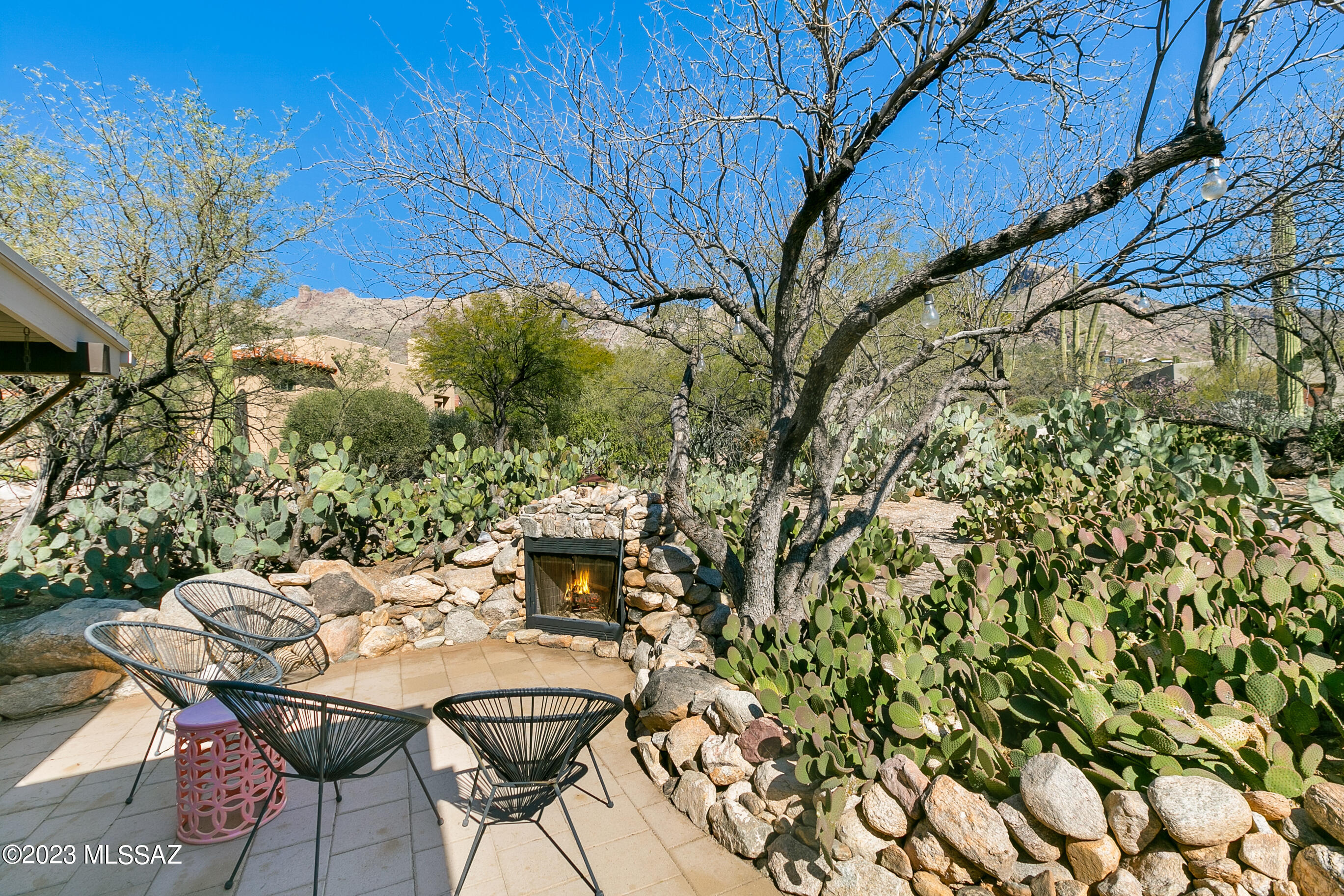 Spectacular city and mountain views in wonderful Coronado Foothills Estates. Newer wood and glass front door welcomes you to a beautifully updated three bedroom, two bathroom contemporary styled home with scored, polished concrete flooring throughout. Updated kitchen with solid wood cabinets, dove tailed, soft close drawers, Quartz countertops, stainless steel appliances, including five burner gas cooktop and large island with bar seating. Open greatroom floorplan with kitchen, family room boasting large bee hive wood burning fireplace, large dining room and living room with open, vaulted, beamed ceilings. Both bathrooms updated with vessel sinks, custom black walnut vanities, master bath walk-in shower with updated tile and floor. Multiple outdoor entertaining spaces including front court yard rock wall with fireplace and pavers, side patio with pavers accessed from primary bedroom sliding door, plus full length covered rear patio overlooking pool and spectacular city views. 
Seller has recently replaced the primary shower floor, installed kitchen island, replaced the front and kitchen French doors, updated the landscaping and irrigation systems, installed water softener, added new light fixtures and recently painted the exterior of the home.