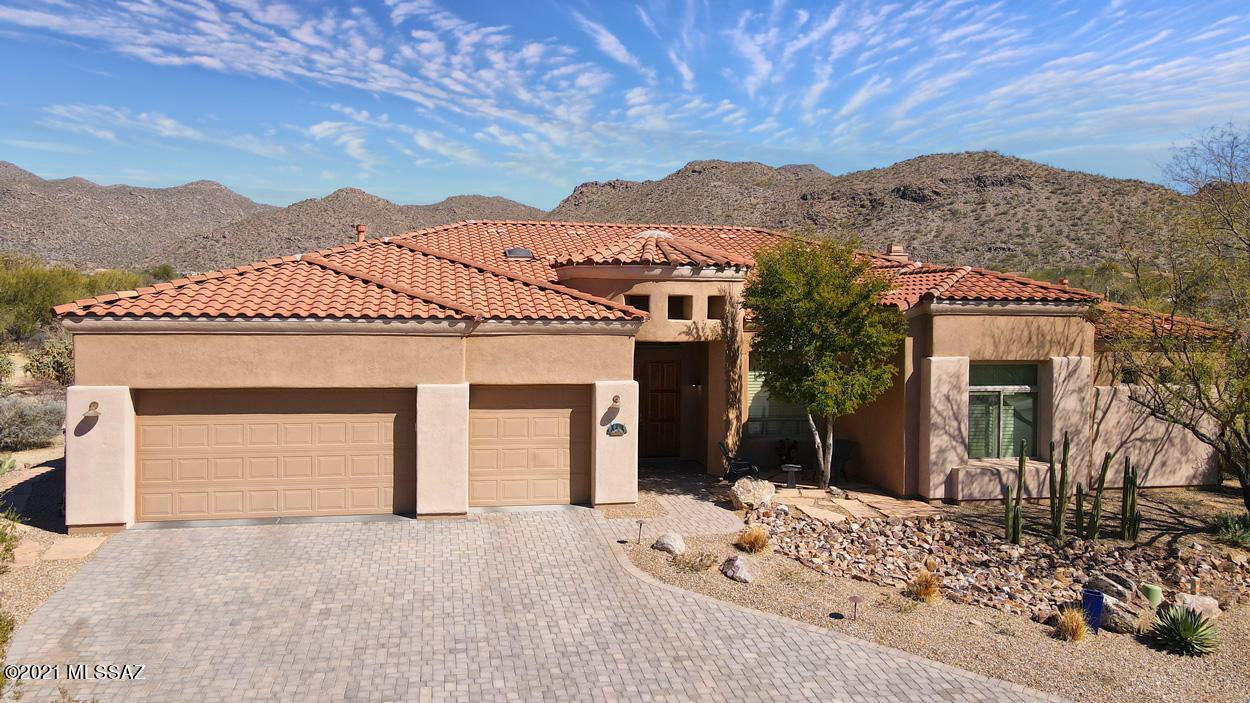Stunning mountain & golf course views! Situated on one of the best view lots in Dos Lagos! Enjoy privacy and spectacular views of the Tortolita mountains. Spacious home offers lots of upgrades and updates. AZ outdoor living at its finest with sparkling pool, spa, firepit, built-in bbq. Elegant, yet warm and inviting interiors featuring remodeled kitchen that opens to great room + separate living & dining rooms. Picture windows capture the sweeping views. Kitchen recently updated to include custom cherry cabinetry, quartz countertops, wine cooler, island, under cabinet lighting & more. Roomy  master suite & remodeled bathroom & travertine floors .  Generous guest bedrooms with Jack & Jill bath. + den/office & 3rd remodeled bathroom.  3 car garage & big laundry with storage.
