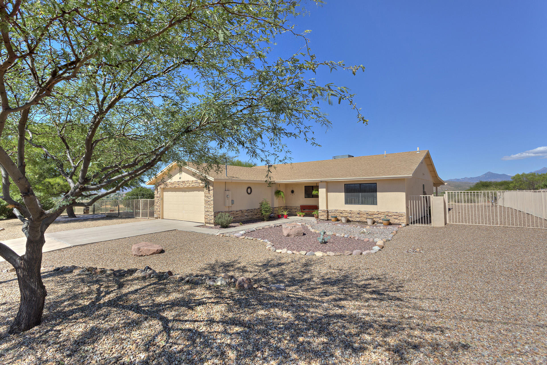 This inviting house with it's outdoor beauty and professional land escape on almost half arce. Spacious front/rear patios, perfect for enjoying cool summer mornings with most awesome views or for outdoor entertaining. This home is immaculate and recently remolded.
