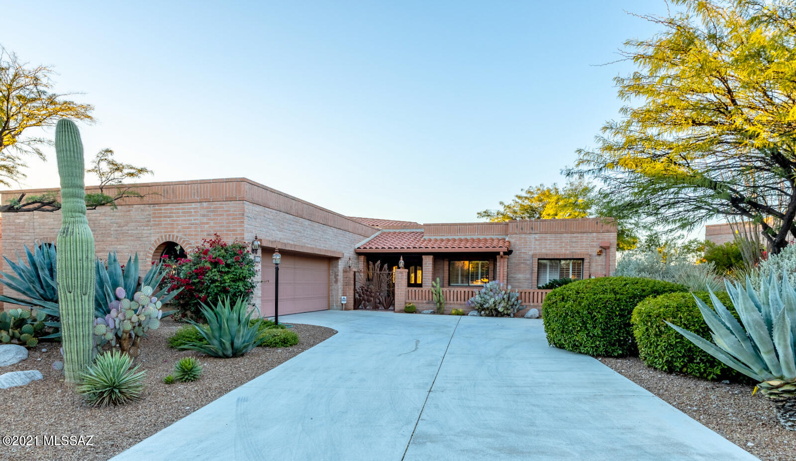 Stunning 'Granada' Model home featuring spectacular sunset and city views. Enjoy the open floor plan and light filled space. Gorgeous designer kitchen finished in grained granite, tumbled stone back-splash and custom furniture quality cabinetry. Don't miss the wine storage niche which adds a splash of sophisticated elegance. Bonus Den is super spacious, can be utilized for media/office/bedroom. Newer HVAC, roof recently recoated, plus No Poly! Enjoy your private heated pool/spa and two expansive patios. Community offers: walking paths, tennis, pool, spa, and rec center.