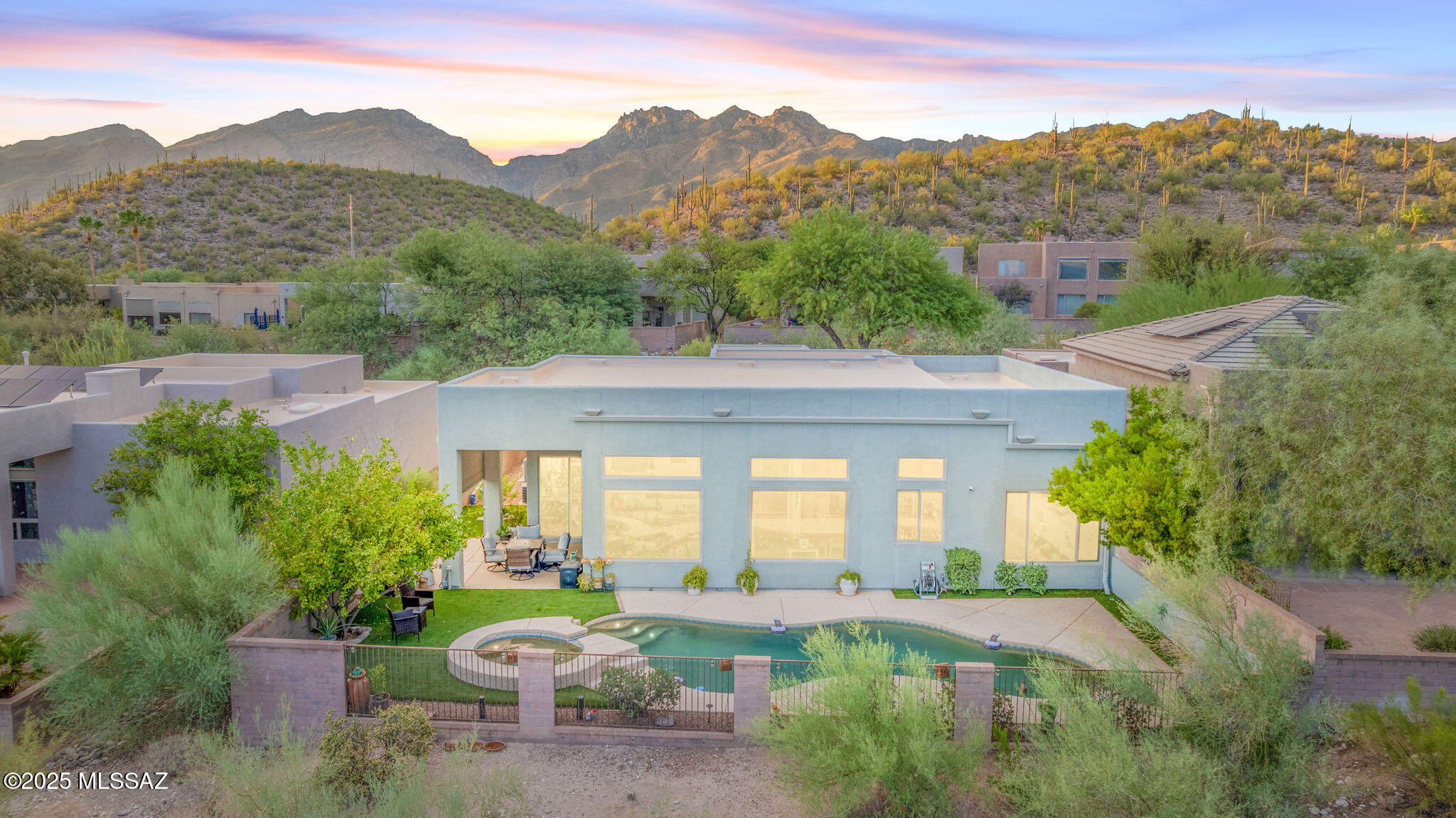 Amazing opportunity for ✨turnkey remodeled 2,807 SqFt 4 bed/3 full bath split floor plan modern home including separate 215 SqFt 1 bed/1 full bath studio quarters in gated Fairfield Bonita Ridge community in Catalina Foothills School district in desirable North Tucson. This is the updated, move in ready luxury Smart home you have been waiting for, perfect solution for multigenerational living! Seller spared no expense on $200K remodel. Single story with no stairs/steps, located at end of whisper quiet cul-de-sac, N/S orientation provide stunning front Catalina mountain 🌄 views, premium elevated.16 acre CR1 view lot with no neighbors behind provide unobstructed sweeping Tucson city views, professionally landscaped front yard with native Sonoran desert plants, irrigation, wired copper landscape lighting, termite warranty, 2025 roof recoated w/3 year warranty, concrete sidewalks, concrete driveway, on and off street parking for guests, security cameras, sealed aggregate concrete walking path leads to new secure ornate metal double front doors. Inside buyers will appreciate soaring cathedral textured painted ceilings, new recessed lighting (20 added), sky lights, energy efficient double pane windows with matching motorized blinds throughout, matching luxury plank flooring (no carpet, no dated tile), matching large modern ceiling fans, copper plumbed Eco water softener, reverse osmosis, zoned gas HVAC (new Rheem 2020) plus garage mini-split, digital thermostats, gas water heater, ADT alarm with Smart panel, internal laundry room with matching GE pedestal washer & dryer included, updated full guest bathroom with matching full slab granite counter, matching 100% solid maple wood modern vanity, walk-in tiled glass shower, spacious living room with wall of large windows provide fantastic natural light, electric wall mounted fireplace, family room adjacent to stunning open concept remodeled kitchen featuring new solid 100% maple wood modern soft close kitchen cabinets, lower shelf pull outs, gorgeous full slab gleaming granite countertops, matching granite kitchen island with prep sink, custom octagon tiled backsplash, all new high end appliances in 2022 including Smart Wi-Fi double gas ovens, Smart Wi-Fi refrigerator, built-in microwave, 5 burner gas cook top with metal exhaust hood, deep farm kitchen sink under garden window with views. Massive primary retreat with matching walk-in closets, stunning ensuite remodeled primary bathroom with dual full slab matching granite countertops, matching 100% solid maple modern vanities, new separate soaking tub and large custom tiled roll in glass shower. Separate entrance 215 SqFt 1 bed/1 full remodeled bath is perfect for extended stay guests. Attached 484 SqFt finished 2 car post tension heated/cooled garage w/sealed epoxy concrete flooring comes with wall of storage cabinets and Smart Telsa car charger.
Experience epic unobstructed Tucson sunsets from your private covered backyard patio with epoxy sealed concrete, motorized retractable patio shade, always green new artificial grass, new metal gutters, water fountain, plumbed for gas barbecue, landscape lighting, irrigation, lemon tree, view fencing surrounding sparkling heated pebble tec pool w/in-floor cleaning system, dual drains, and elevated in ground spa with cascading waterfall, complete with all new pool equipment in 2025.
Located minutes away from fine dining, shopping and popular Sabino Canyon. Whether you are a local Tucsonan or a seasonal visitor looking for a turnkey move in ready retreat, call to make your appointment to view this unique property today!