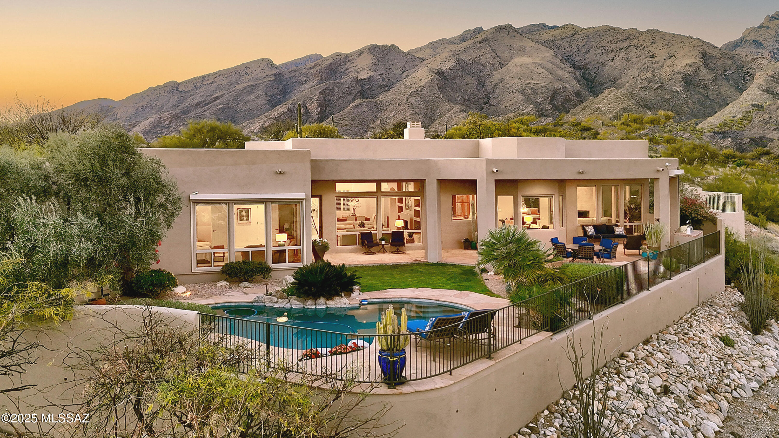 Stunning soft contemporary w/ truly incredible city & mtn views on over 1 acre in prestigious Alta Vista. Front gated courtyard w/ cactus fountain, exquisite living room w/ high ceilings, elegant fireplace, walls of windows to capture the breathtaking views, formal dining room, light and open gourmet island kitchen w/ stainless steel appliances, pantry, lovely breakfast area open to the family room w/ fireplace, beautiful tile floors, 3 bedrooms plus study or 4 bedrooms, 3 baths including amazing primary suite w/ bamboo floors & luxurious bath, large walk-in closet & private entry to the rear patio. Laundry rm. w/washer, dryer & sink, & 3 car garage w/ storage. Enjoy the fabulous backyard with covered flagstone  patio, pool, grass, BBQ, lush landscaping, Dist. 16 schools & VIEWS!!!