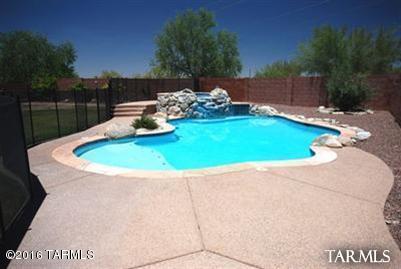 ALL COMMUNICATIONS AND NEGOTIATIONS SHALL BE CONDUCTED ONLY THROUGH THE OWNER/AGENT. 4/2,NO CARPET,MONTHLY LAWN SVC AND POOL SVC INCLUDED; LARGE, FENCED PLAY POOL/ RAISED SPA; GRASS AND TREES; NO CARPET; HUGE KITCHEN WITH GRANITE, PANTRY, BREAKFAST BAR; UPDATED MASTER BATH FULL LENGTH, COVERED PATIO WITH FANS AND LIGHTS; GAS FIREPLACE; OVERSIZED GARAGE WILL FIT SUV AND CAR; R/O AND WATER SOFTENER; ATTIC ABOVE GARAGE WITH PULL DOWN LADDER; GARAGE SINK; EASY ACCESS TO TWIN PEAKS AND I-10 AND SHOPPING; WALK TO SCHOOL AND SHOPPING; ALDER WOOD CUSTOM BUILT IN DESK WITH GRANITE AND RAIN GLASS; GAS FIREPLACE; NO CARPET; SECURITY FEATURES; ;UPDATED MASTER BATH AND WALK-IN CLOSET; AMPLE SECONDARY BEDROOMS; THANKS!Owner/Agent.