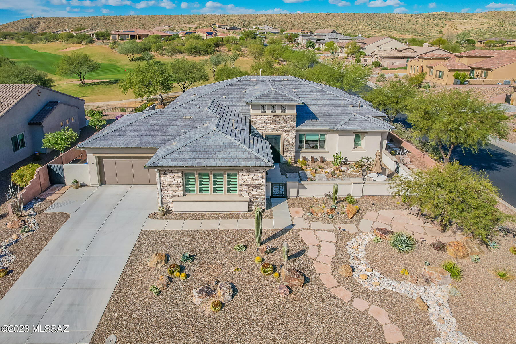 Luxury living on The Preserve golf course with golf & mountain views. This highly upgraded Sonrisa 2BD/2.5BA + Den (3110 SqFt) is better than new. Enter the home through the elegant customized iron doors to the spacious great room with golf course views. Magnificent quartz water fall island shows off the contemporary kitchen w Wolff & Sub-Zero stainless appliances, beautiful backsplash, under cabinet lighting & butler's pantry. Thoughtful owner's retreat has an ensuite with a walk-in shower & generous closet. Biltmore hotel inspired entry to large Den. Sophisticated lighting and fans throughout. Home is prewired for solar & surround sound. Backyard oasis has an extended covered patio, 21' fire wall, pebble tec pool, & #13 fairway views! SaddleBrooke is a premier active adult community.