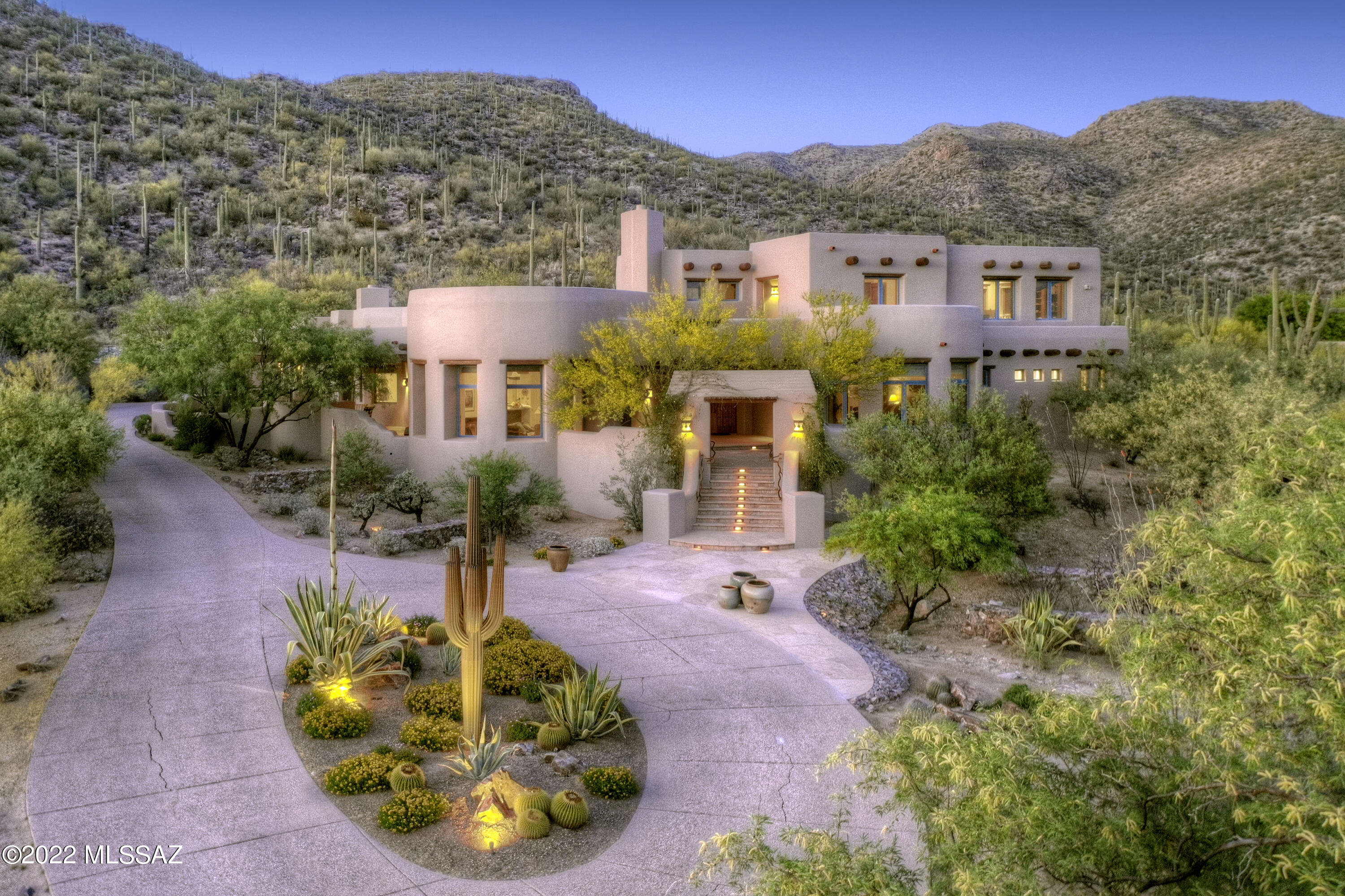 Rare opportunity to own a charming & sophisticated Santa Fe on 3 acres w/ mtn & city views bordering the 
National Forest. Located in one-of-a-kind gated subdivision w/ community amenities including horse facilities, stables, pool, tennis, rec center & a pond. Stunning home with front courtyard, Greatroom with fireplace, dramatic high beam ceilings, formal dining room, gourmet island kitchen w/ granite countertops, Viking appliances, 6 burner gas range, SubZero, lovely breakfast room w/ fireplace, beautiful tile floors, Pella wood-cased windows. 4 bedrooms + loft & exec office w/ built-ins, 5 baths, Master w/ his & her baths and 2 walk-in closets. Enjoy outdoor living w/ covered flagstone patio, BBQ, serene setting, upstairs viewing deck, 3 car garage, Tanque Verde schools, Views! Views!