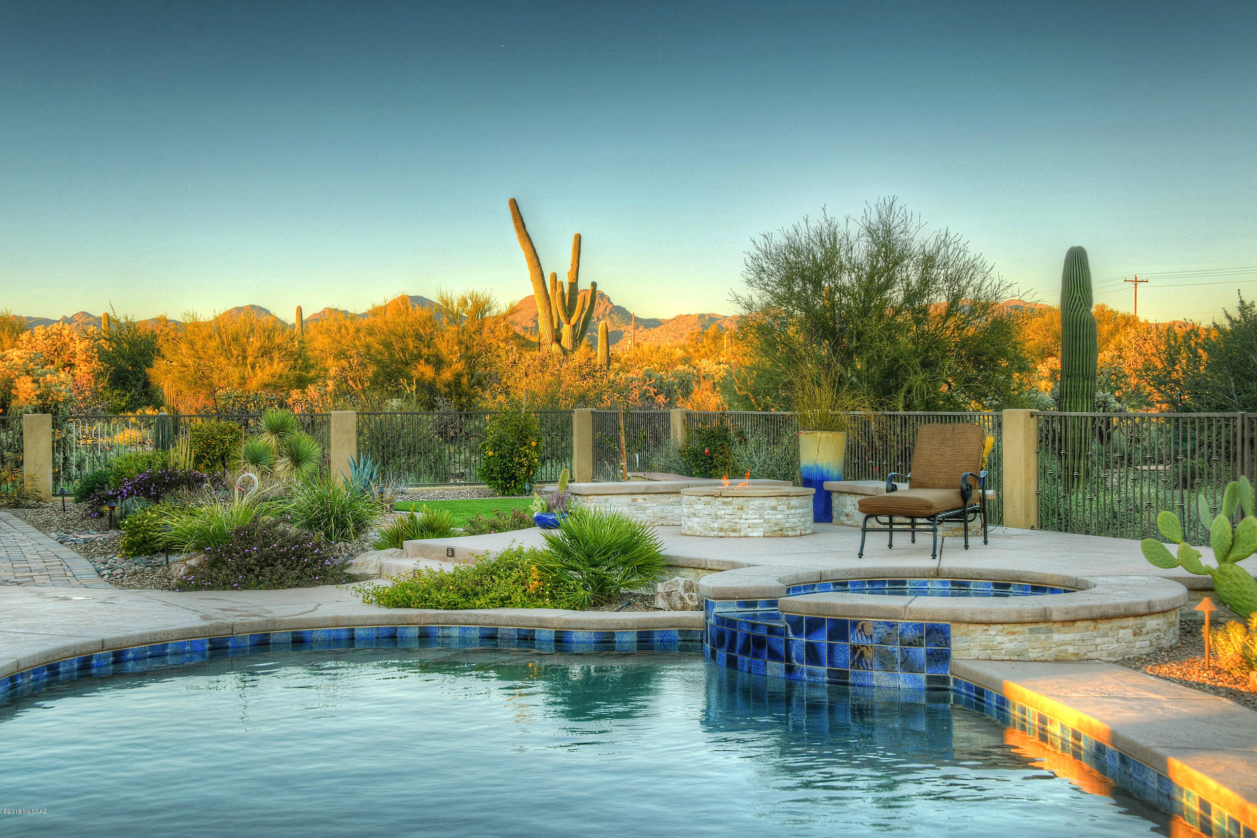 *DESERT OASIS* INCREDIBLE CUSTOM ESTATE NESTLED ON 3.3 ACRES- *NO HOA* SURROUND BY THE BEAUTY OF THE''SONORAN DESERT'' IN EVERY DIRECTION! EAST FACING BKYD IS A TRUE PARADISE! OFFERS ''RESORT FEEL'' HEATED POOL/SPA, ALFRESCO BB/KIT, FIREPIT, PAVED PATIOS GALORE, EVEN UPSCALE CHICKEN COOP- FOR ORGANIC EGGS! BEST OF ALL STUNNING MTN/DESERT/CITY LIGHT VIEWS FOREVER! ENJOY COMING HOME TO ''PRIVATE GATED'' ENTRY- PAVED MOTOR COURT-4  CAR EX'TD GARAGE!  QUALITY UPGRADES ... NATURAL STONE FLRS, SOLID WOOD 8 FT DRS, STONE FP, LIBRARAY/DEN,  SHUTTERS!  EVERY COOKS DREAM KIT! TONS OF CTRS,WORK ISLAND, ALL SS, 2 OVENS, STONE BKSPLASH, & ONE OF THE LARGEST WRAP  BKFAST BARS! 2* GUEST BR WING INCLS ,EN-SUITE BR, 2 BATHS & *BONUS /REC RM ! MSTR RETREAT-VERY LUXURIOUS...SPA BATH/SHOWER , SHOWPLACE CLOSET