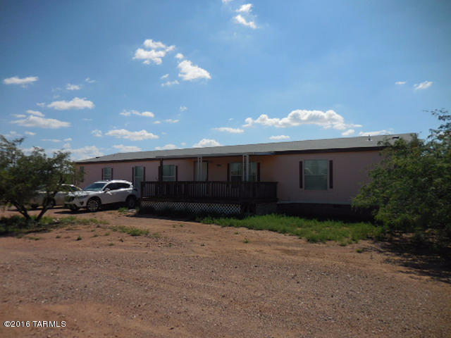 Nice 5 bedroom 2 bath manufactured home with lots of living space and large kitchen. Located on one acre with nice access to the highway and city.  Vail water with covered porch and patio at side of house.   Interior recently painted, masonry skirted, 3 year termite warranty on home and extra insulation installed under home.  Lot of house for under $50 square foot.