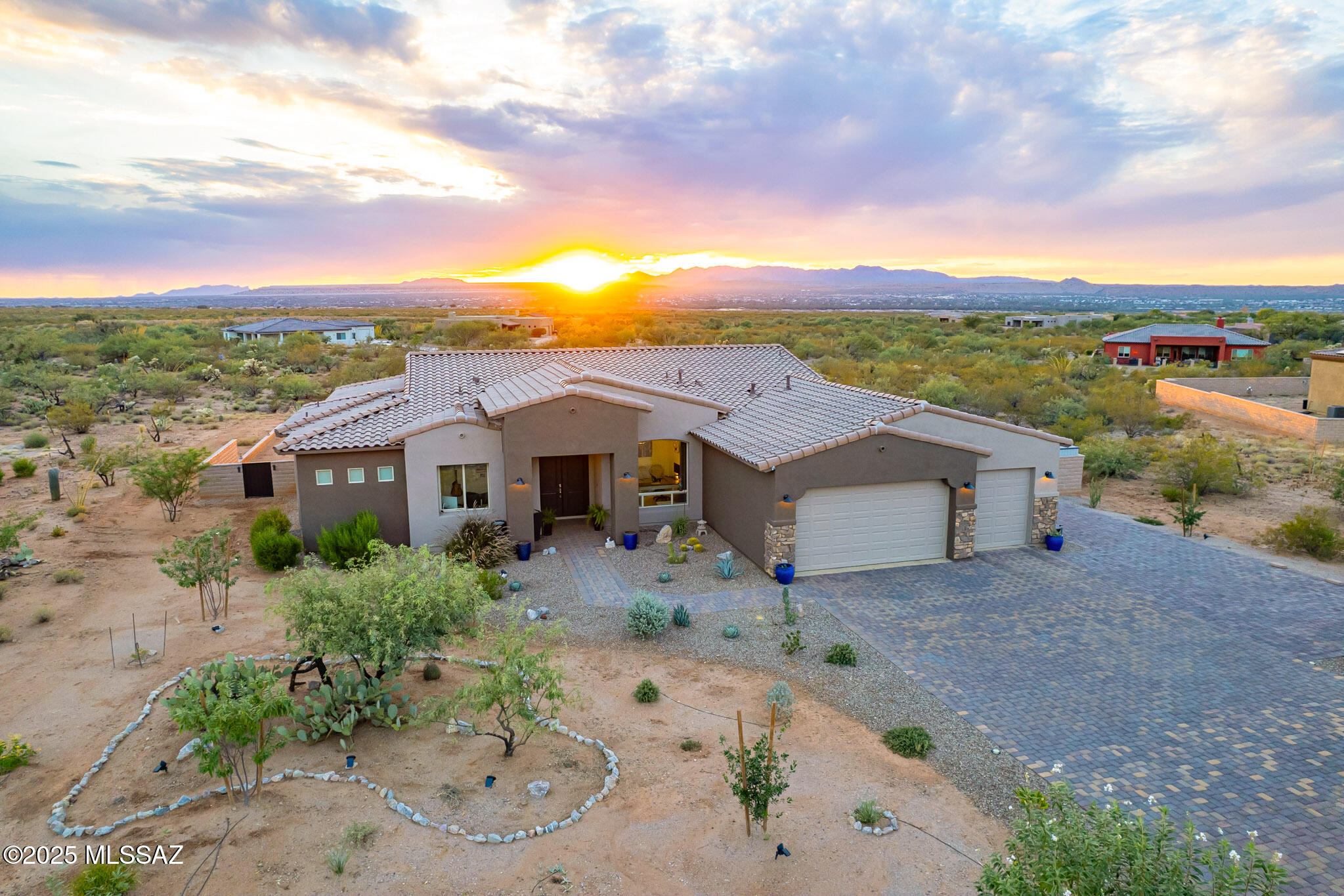 Beautiful [newer built] home featured on an acre lot in the acclaimed private community of ''Stone House'' located in the heart of Sahuarita, AZ. This highly upgraded estate incorporates a subtle balance of contemporary finishes with a modern design. The home features 4 bedrooms, 3 full bath(s), 2,921 sq ft open concept floor plan, a spacious living space, a nicely appointed kitchen w/ granite countertops, large [eat-in] island, shaker panel cabinetry, KitchenAid SS appliances, gas cooktop, and pantry. Also, this home features 12ft ceilings, tile flooring, modern plumbing/lighting fixtures [fans], dual pane [low-e] windows, designated dining space, den/study room, and a dedicated master retreat featuring a spacious sleeping quarters, large shower, stand alone soaking tub, dual sinks.. and a large walk-in closet. Lastly, this home features a gorgeous front entry w/ 8ft tall entry doors, a 3-car garage w/ 4ft extension, epoxy floors, water softener, a 2-Zone HVAC system, RV gate, and a private backyard retreat featuring a large covered patio, extensive terrace landscaping, and stunning mountain views--perfect for entertaining guests & family. Stone House community offers residents scenic walking/bike trails, plenty of green spaces, and is just minutes away from wonderful shopping & dining.