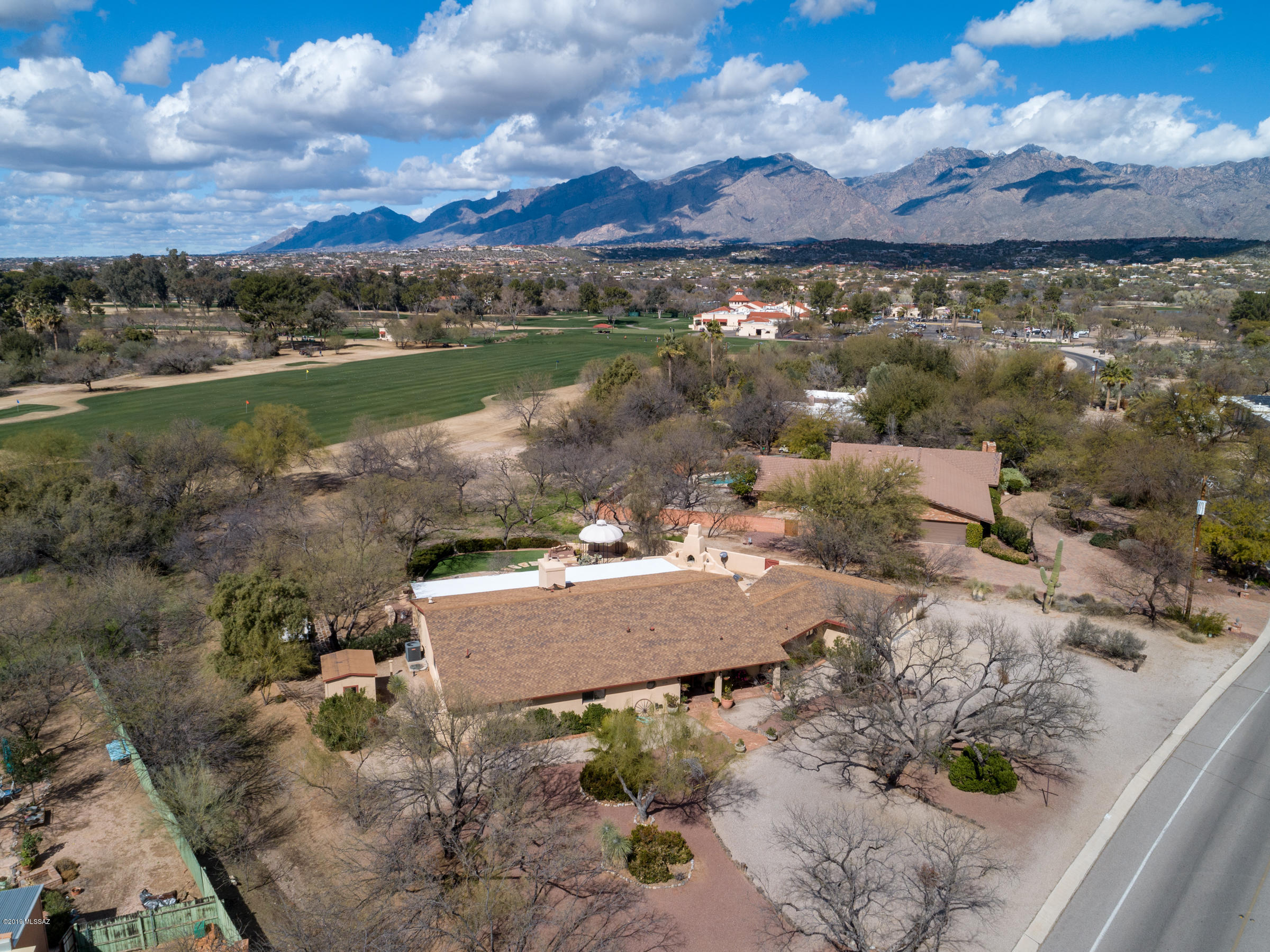 MOTIVATED SELLER. BRING ALL OFFERS. Large, quiet home in sought after TCC. Expansive flagstone patio complete with an outdoor fireplace and built in gas grill overlooking the golf course. Colored concrete floors, split floor plan, bonus room, and extended garage with workshop area. Ask about seller/lender incentives up to $10k.