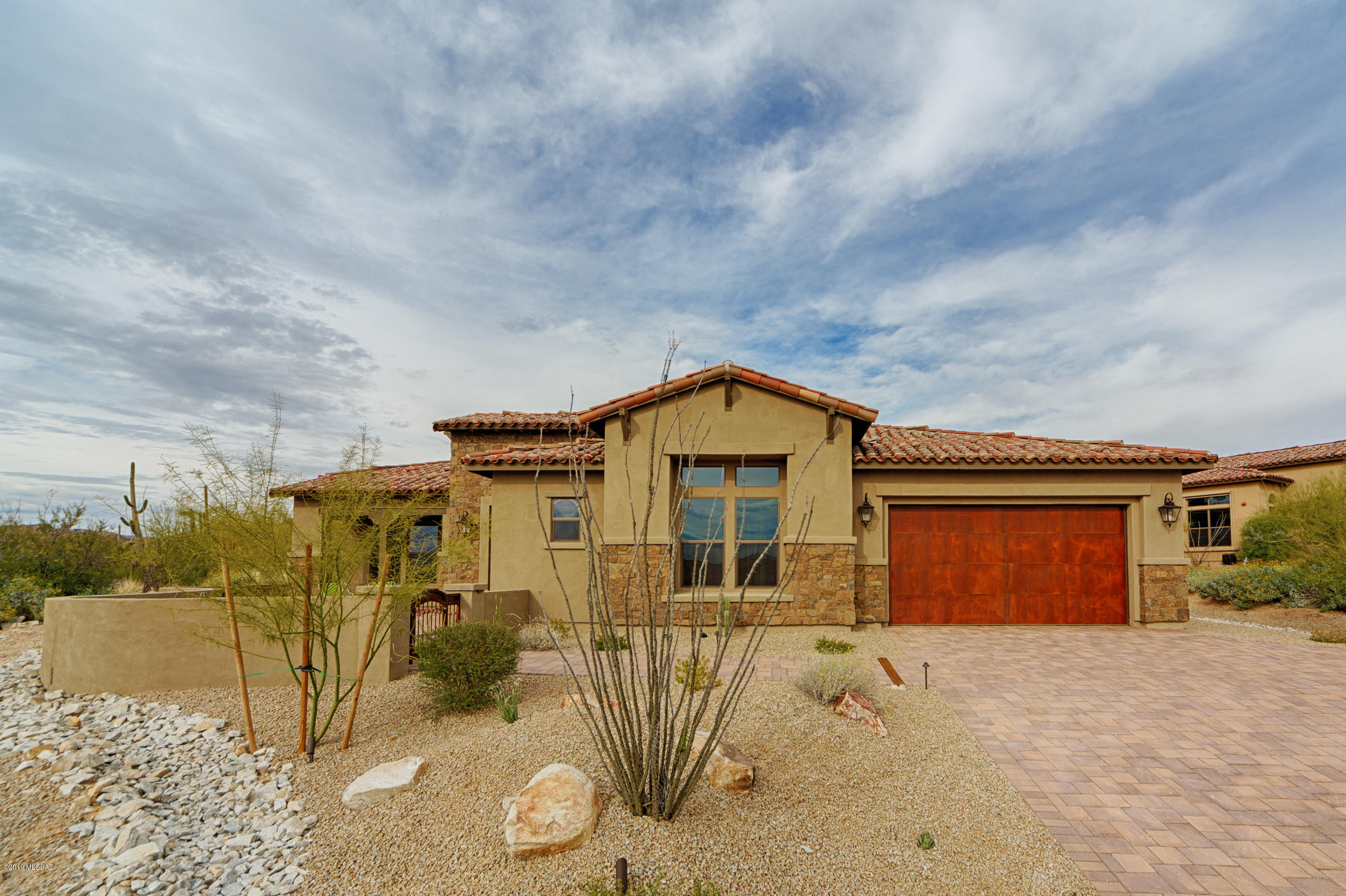 Brand NEW energy-efficient home ready NOW! Saguaro Mediterranean style home is perfect for entertaining, elegant foyer to grand formal dining room, gourmet kitchen with an oversized island that overlooks the nook and great room flowing
out to the covered patio. Corner meet sliding doors bring the outside in for that true southwest lifestyle. A master wing embodies tranquility while each bedroom boasts a bath and walk-in closet! This home has Davenport style cabinets with a brown antique glaze, laminate wood flooring and Copenhagen granite countertops. Love living in the gated community of Stone Gate at Stone Canyon with the beautiful Phil Michelson Stone Canyon golf course. Known for their energy efficient features, our homes help you live a healthier and quieter lifestyle while saving you thousands on your utility bills
