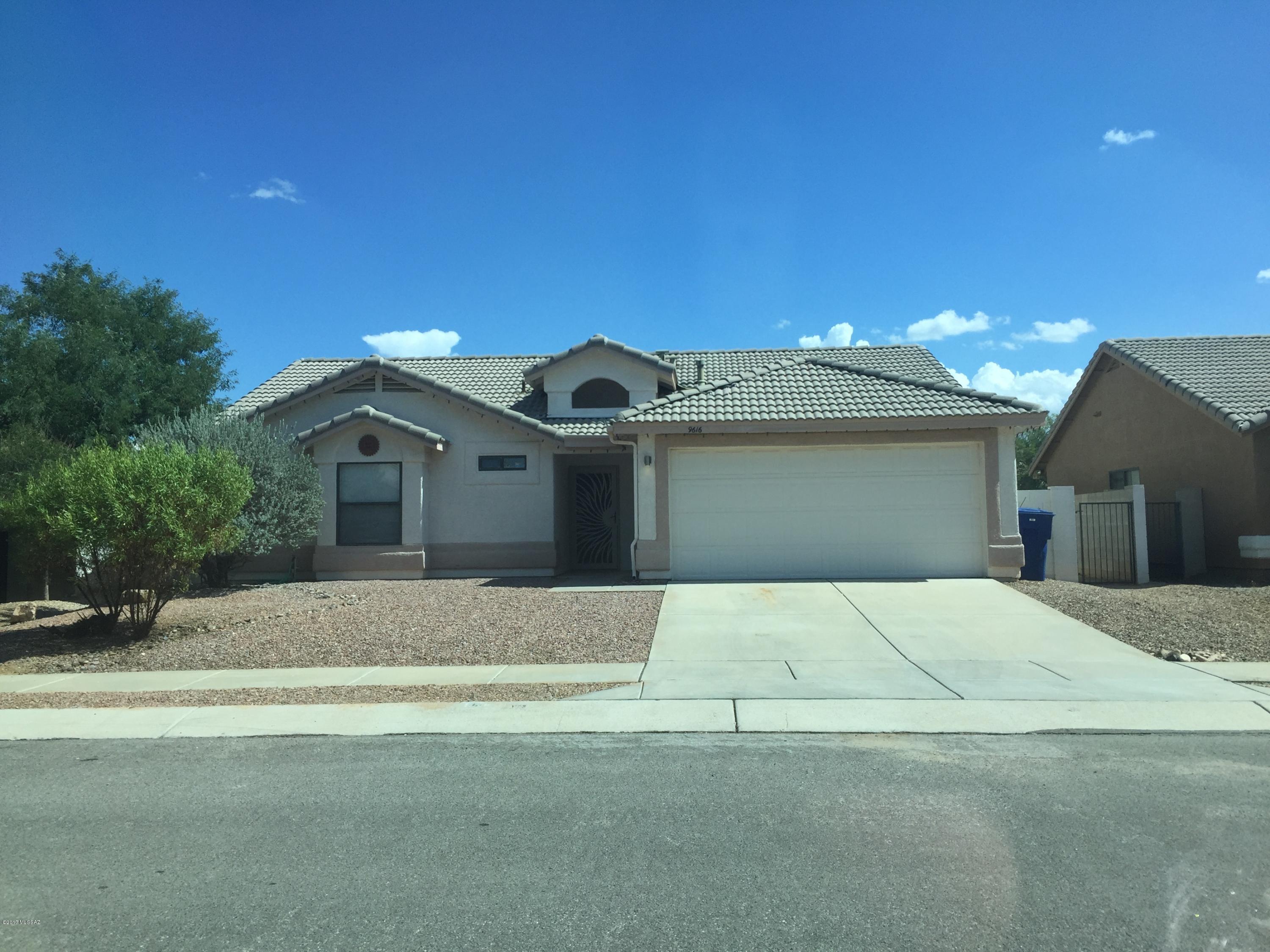 9616 E Dunnigan Drive Tucson, AZ 85747. 3 bedroom 2 bath single family home with a bonus Arizona room. All bedrooms have a walk in closet. Tile floors in the entire house. Stainless steel appliances and updated bathrooms. Fully landscaped backyard with artificial grass. No HOA. 2 car attached garage.