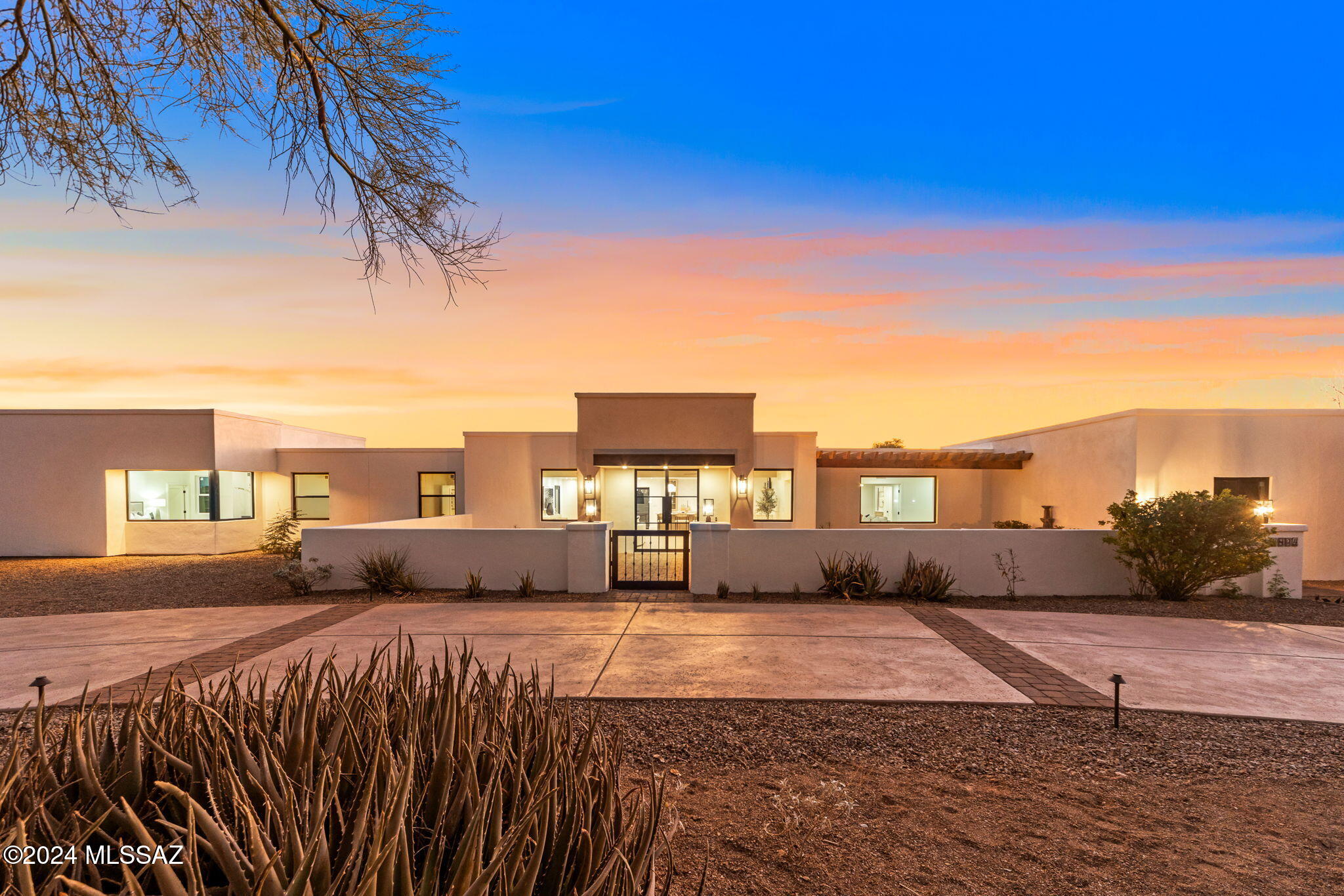 Modern Southwest Masterpiece in the Catalina Foothills

Nestled on nearly an acre of desert landscape, this beautifully remodeled home offers breathtaking views of the iconic Catalina Mountains. From the moment you arrive, the charm is undeniable, with a colored concrete circular driveway featuring brick inlays that mirror the inviting brick courtyard and fountain.

Step inside through custom Pinky's glass double doors to an expansive open floor plan anchored by a stunning fireplace, flanked by wood shelving that adds warmth and character. The heart of the home is the chef's kitchen, boasting a 48-inch gas range, a counter-to-ceiling quartz backsplash, and custom cabinetry with glass inserts. A striking range hood adds to the elevated design... For added convenience, the butler's pantry offers an abundance of additional storage, a second full-sized sink, dishwasher and open shelving, perfect for entertaining. The bright and airy laundry room ensures function meets style.

Wine enthusiasts will fall in love with the dedicated wine room, complete with a wet bar and a wine fridge capable of holding 152  bottles of wine.

The primary suite is a private retreat, with large picture windows framing awe-inspiring mountain views. A custom walk-in closet with an organization system adds functionality, while the spa-like bath includes a 11-foot glass-enclosed walk-in shower with double rain head showers, and hand held shower wands, toto bidet seat, a soaking tub, and a floating double vanity with a dedicated makeup area.

The home also offers a flexible junior suite can be used as a bedroom, office, or theater room, offering additional versatility with its own private bathroom with walk-in shower, walk-in closet and linen closet. 

It also offers a chic powder room with direct access to the backyard makes hosting poolside gatherings a breeze. 

The brand-new pool features elegant travertine coping, seamlessly connecting the indoor and outdoor living spaces. Both the front and back yards have been thoughtfully designed, with lush landscaping enhancing the serene desert ambiance.

This modern organic designed home in a beautiful neutral palette effortlessly blends modern elegance with desert charmtruly a must-see in the Catalina Foothills!

Seller is licensed to sell real estate in Arizona.