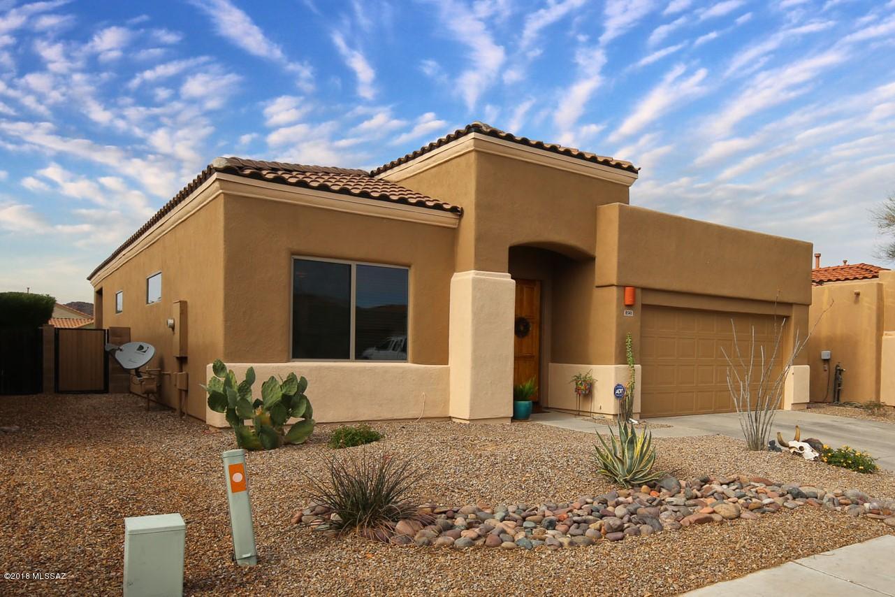 Spectacular updated home in gated Sierra Crest, a special part of Continental Reserve with its own pool and common areas. Stained concrete floors, granite counters, decorator paint, high ceilings and fans are just some of the features of this special home. Spacious backyard includes a covered porch and brick pavers with room to play. It borders a wide common area with no homes directly behind and views to Sombrero Peak. Very close to community park, elementary school, shopping and restaurants.