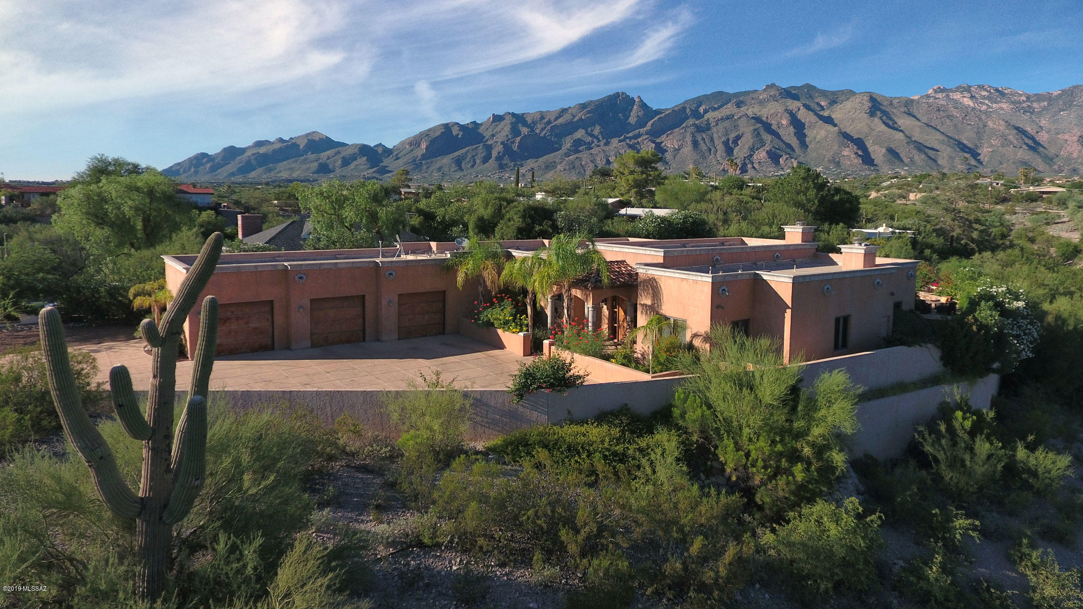This magnificent 4BR/3.5BA estate in the foothills was designed with luxury in mind.  A dignified courtyard entry is an impressive introduction to the grand foyer beyond.  High ceilings, travertine tile flooring, designer fixtures and high end finishes complete the exceptional design. Gorgeous gourmet kitchen has every asset imaginable including wine fridge, commercial gas range, double ovens & instant hot water pot filler. Master suite with fireplace, oversized bathroom & walk-in closet.  4th bedroom has been converted into a stunning dressing room and has attached bath.  Backyard is made for relaxation with tranquil fountains flowing into the pool, elevated spa, fire feature, outdoor kitchen, fireplace, covered patio and mountain views. 3-car garage & No HOA.