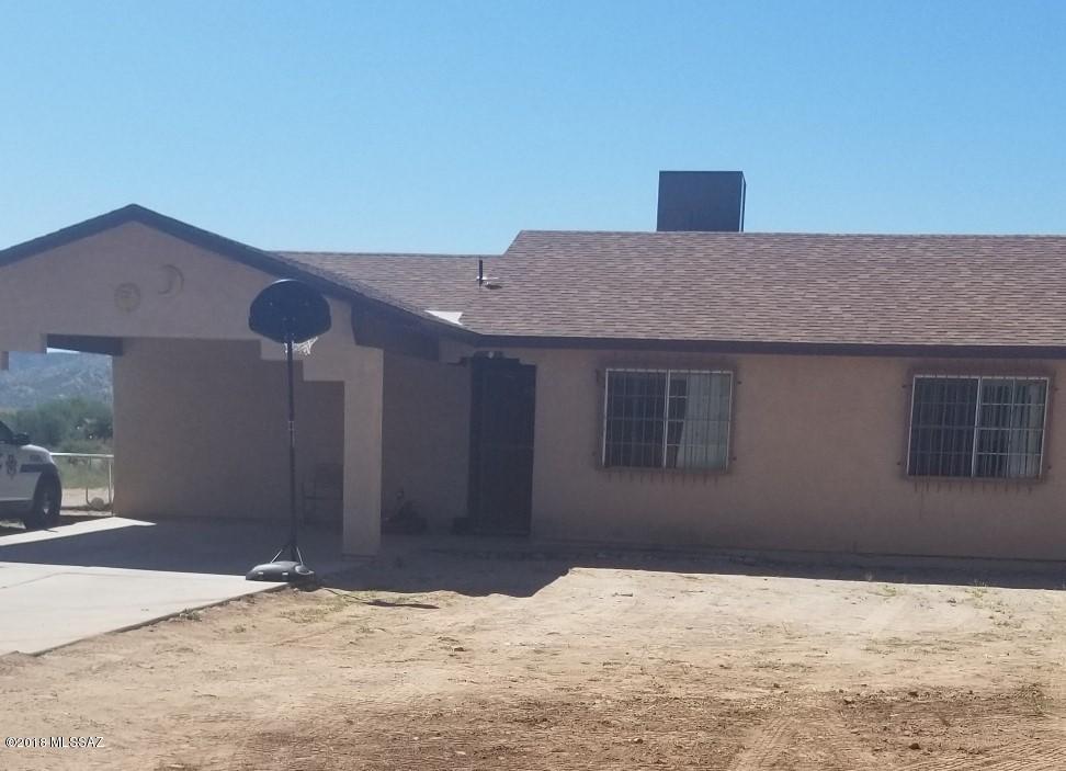 This  long private  driveway is all concrete leading you into this bright Stater Home with 3 bedrooms and 2 bathrooms, heat pump with an acre of land. So your family can enjoy the spacious backyard.