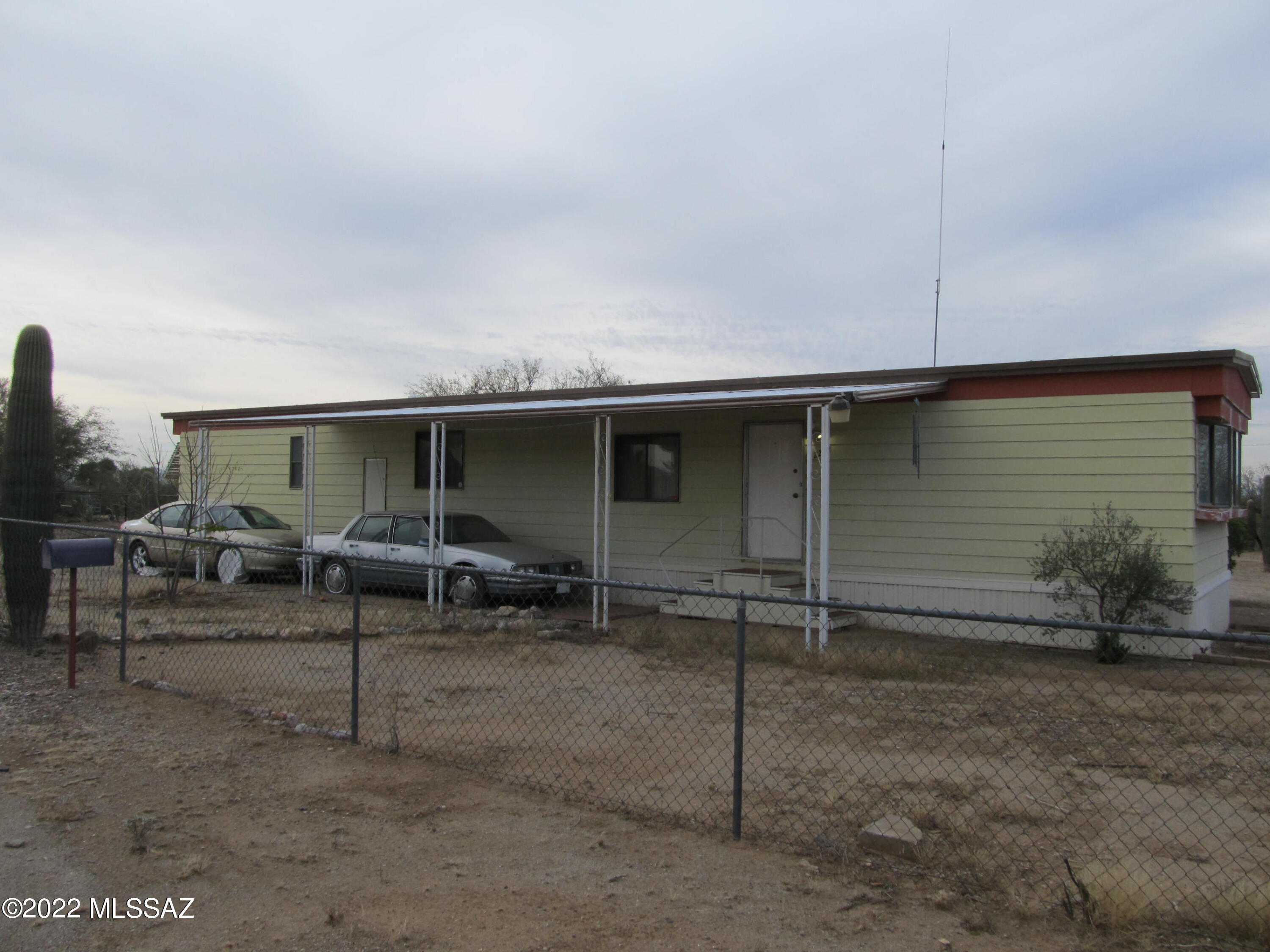 Nice and clean 1 acre parcel with a 2 bedroom 2 bathroom Mobile home. Horse property. Paved roads all the way. Quiet street. Natural vegetation. Completely fenced with chain link. The Mobile home is in good shape and has all the appliances including refrigerator, washer, dryer. Move in ready. No HOA of course.