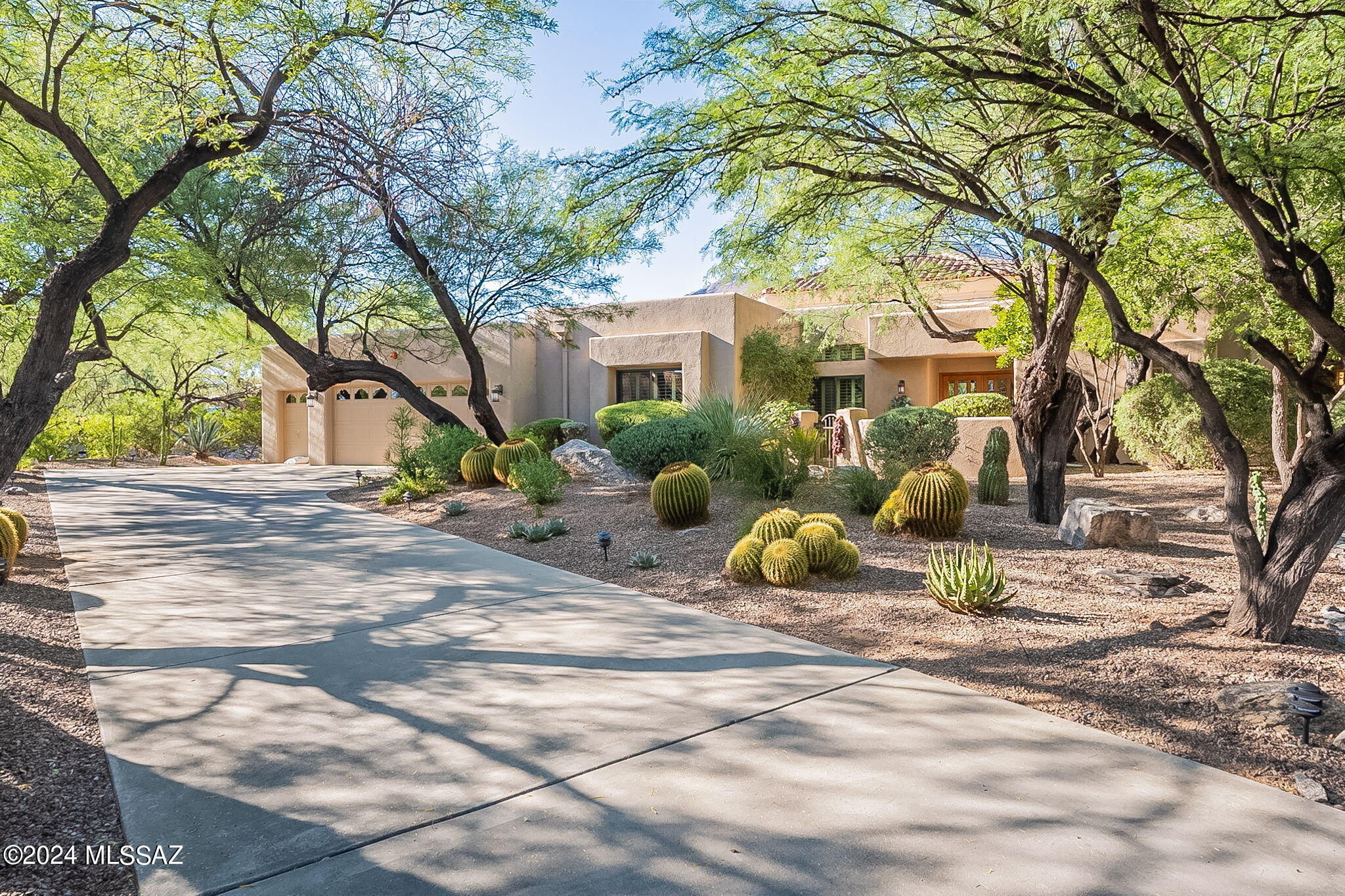 In The Rarely Available Serene Enclave of Desert Moon Estates in Ventana Canyon Sits The Ultimate In Low Maintenance ''Lock & Go Living'' In This 3 BR & 3 BA 2,700 SqFt Custom Home. Fine Features Include: Private Lot - Lush Vegetation - Courtyard Entry - Living & Dining Areas w/ High Ceilings & Clerestory Windows - Updated Kitchen w/Stainless Appliances & Quartz+Granite Counters & Breakfast Bar + Nook All Opening to Family Room w/ Gas Fireplace - Spacious Primary Suite w/ Updated Bathroom w/ Shower & Separate Garden Tub - New Trane HVAC's (2023) & Rheem Water Heater (2024) - Charming Back Patio w/ Mountain Views, Built in BBQ, Beehive Fireplace & Water Feature - Coveted 2 Car Garage + Golf Cart Garage! Close to Golf, Tennis, Pickleball, Swimming, Dining & More at the Ventana Canyon C.C.