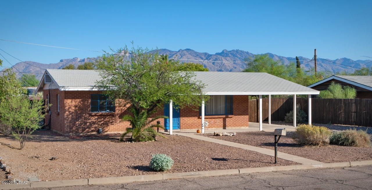 This adorable 2 BR/1BA Red Brick Bungalow is Move-In Ready.  Great location near Campbell/Grant makes for easy access to U of A, downtown,  or Banner Hospital. Freshly painted interior, ceramic tile floors throughout,  updated kitchen with: breakfast bar, gas range. All appliances stay. Large laundry room inside home with laundry sink. Huge fenced yard can accommodate a pool, an addition or 2nd unit since property is zoned R2. You can even have Mom and Dad visit in their RV.