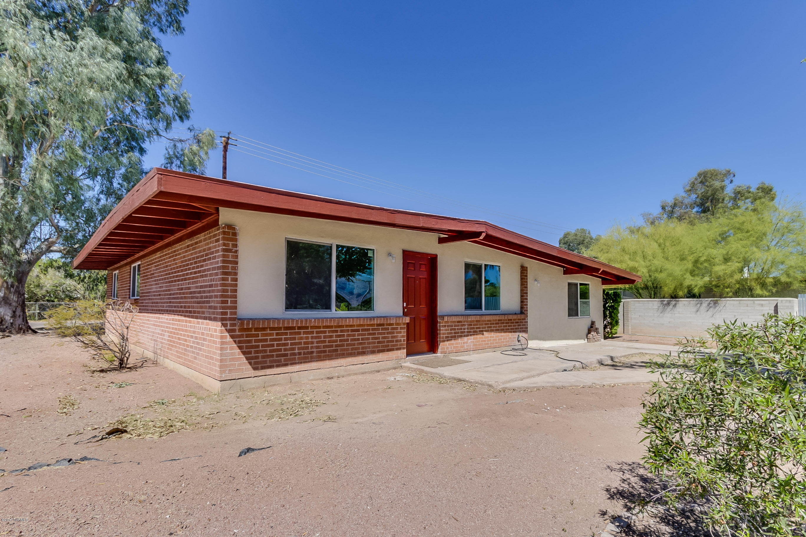 Completely remodeled!  Like new and just waiting for you! The great 3 bedroom, 2 bath, 1410 sq ft home has NEW HVAC system, flooring, cabinets, plumbing fixtures, light fixtures, interior doors, stove and dishwasher and roof was just repaired and re-rolled.  Front yard is in the process of being landscaped.  Great backyard with large covered patio. Wheel chair ramp from family room to kitchen.  A must see!