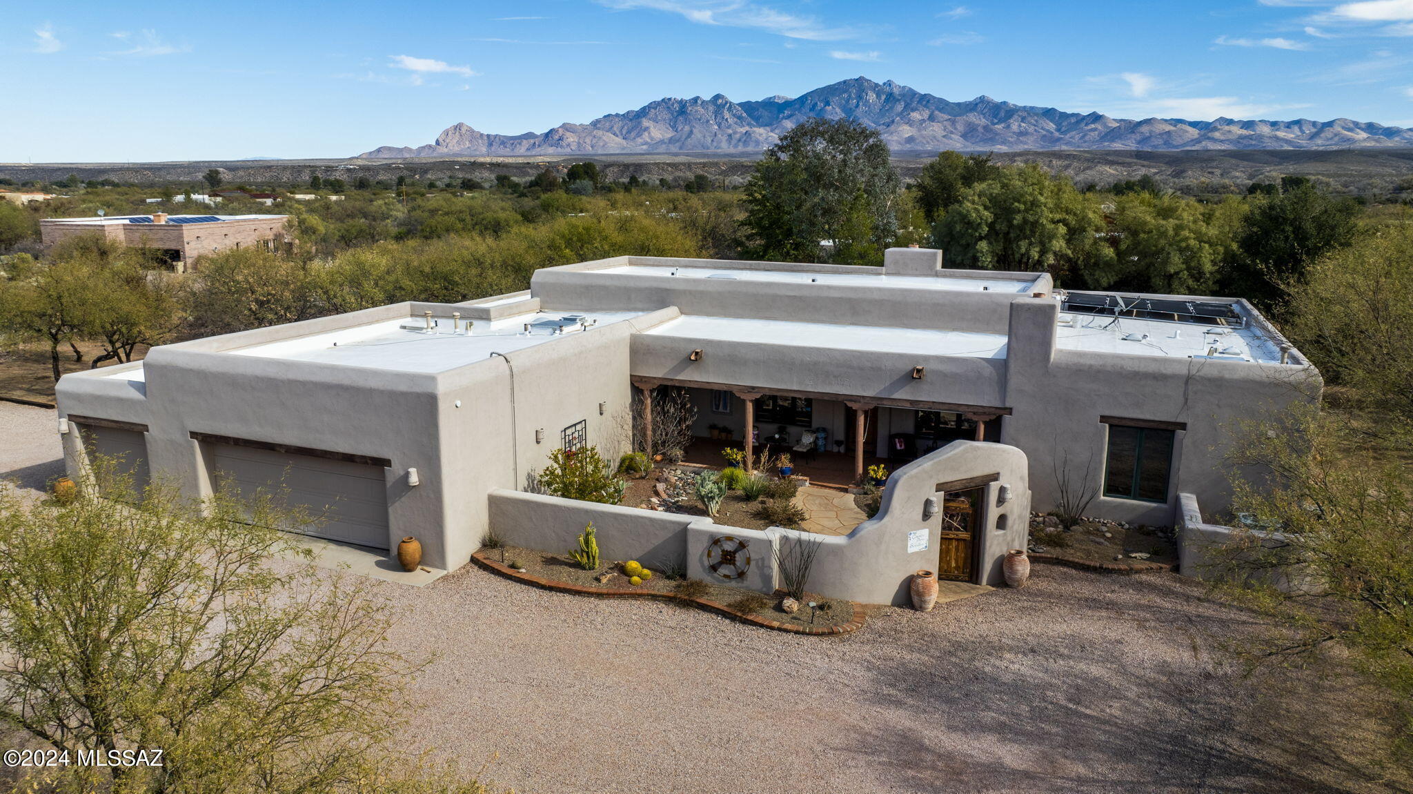 Enjoy peace, privacy, and iconic views in this sprawling (3 br, 3 ba) home with a private pool located in the idyllic Tubac Valley Country Club Estates. Here you'll find an open-concept interior featuring design details like paver flooring, exposed beam ceilings, custom millwork and cabinetry, exposed stonework, and multiple fireplaces. Outdoor spaces include a gated and walled front courtyard and an expansive walled poolscape, wall fountain, and open and covered terraces for elegant outdoor entertaining, all with panoramic high desert views. Light, bright kitchen features quartzite counters, stainless steel appliances, seated bar for casual dining, and a walk-in pantry. Fabulous owner's retreat offers direct terrace access, spa-like en suite bath. With home sites ranging from .5 to 1+ acres, you'll find everything you're looking for in this community surrounding the Tubac Golf Resort and Spa. Fabulous, established neighborhood with mountain views and room for additional residential construction. Create the home you've been dreaming of in one of Tubac's best communities.