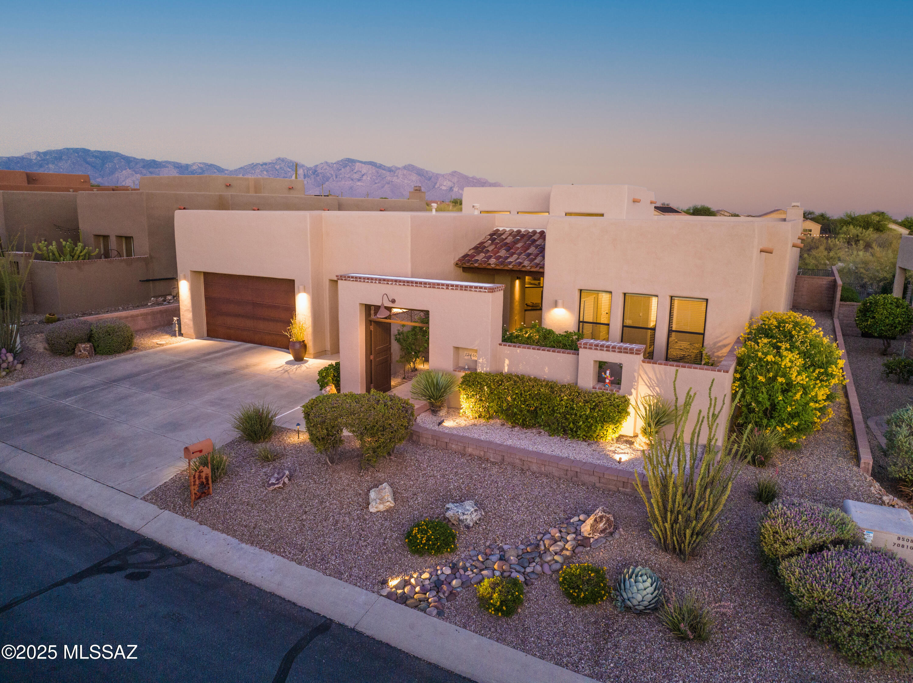 Southwest Luxury with Catalina Views. Nestled in the prestigious Dove
Mountain Foothills, surrounded by the breathtaking beauty of the Sonoran
Desert and majestic mountain ranges, this exquisite residence by Insight
Homes showcases the extended Eagle floor plan—crafted to offer a
lifestyle, not just a home. Positioned to capture Catalina Mountain views,
this residence offers an unparalleled sense of privacy and tranquility,
enhanced by direct access to hiking and biking trails, world-class golf, fine
dining, and the nearby Ritz-Carlton Resort. Arrive at a gated front
courtyard, adorned with a bubbling fountain and climbing roses, offers a
graceful entry into the home. Inside, you're welcomed by a grand foyer that
opens to expansive formal living and dining areas,