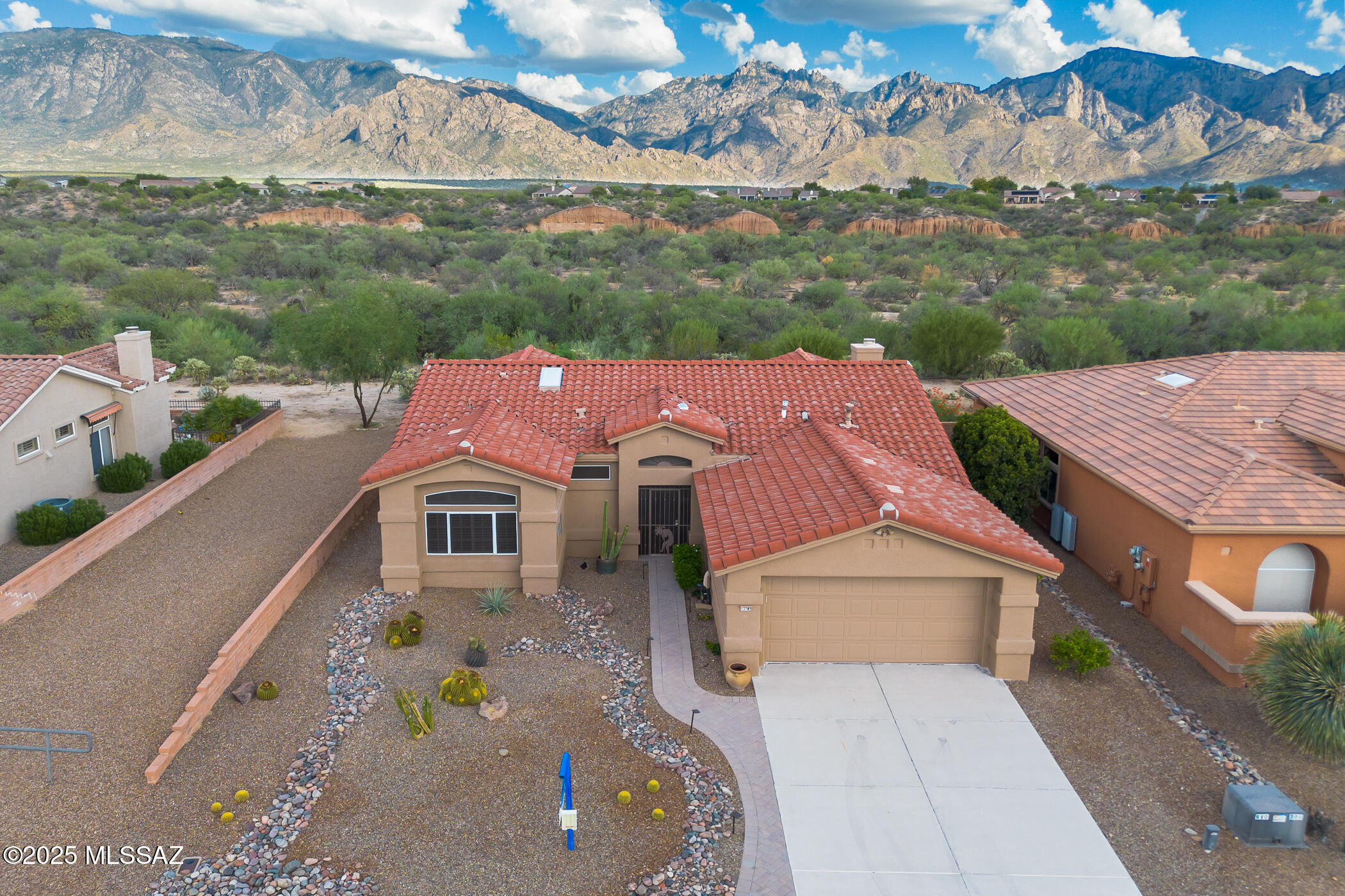 If you've been waiting for gorgeous views and a move-in ready, stunningly updated home in coveted Sun City Oro Valley, this could be your lucky day! You'll want to move right into this beautiful, fully remodeled home & begin your active adult lifestyle. Boasting high quality custom finishes, this Windsor-model home is a showstopper. You'll enjoy the East-facing Catalina Mountain views from almost every room, as well as from the expansive, paver patio & beautifully maintained backyard. This gorgeous home features tile flooring throughout, many sparkling new windows, new HVAC, updated lighting, open (walls removed) great-room design, gas fireplace & so much more! The stylish, remodeled Chef's kitchen features modern stainless-steel appliances, updated shaker-style cabinets, quartz countertops, tile backsplash & a large island w/breakfast bar. Enjoy the Catalina Mountain views from the kitchen and family room, as well as from the great room & dining area. The spacious master bedroom is a comfortable retreat featuring mountain views from the bay window, plus an expanded en-suite bath with quartz-topped dual vanity, large soaking tub & custom walk-in shower. The roomy guest bedroom has plenty of closet space & is located next to the updated hall bath showcasing a quartz countertop & tiled shower. Enjoy outdoor living in the peaceful, easy-care backyard as you soak in the gorgeous Sonoran Desert & panoramic views of the Catalinas. It's hard to find a home that has it all - views & updates - in Sun City Oro Valley. Don't miss your opportunity to own a small slice of heaven on earth!