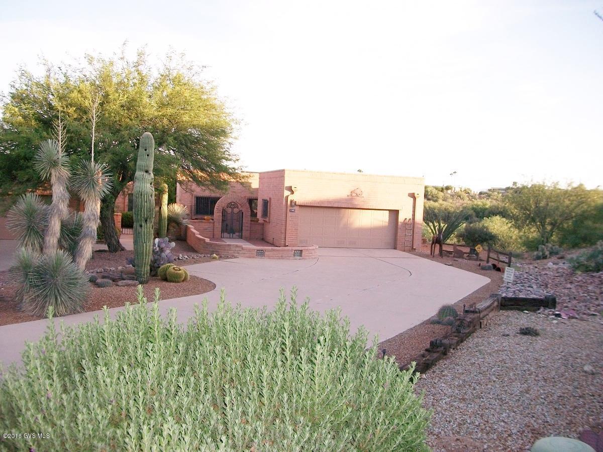 Owner agent. Magic will happen when you enter this exciting 2BD 2BA + DEN/OFFICE townhome with Zillion Dollar Views! 3 patios for gatherings - Saltillo tiles throughout. Enjoy preparing food on a chef's stainless prep table in the mesquite kitchen with ceiling vigas and a Wolf Gourmet gas range. The unique kitchen's direct and indirect lighting brightens the breakfast nook under an old cantina tin roof. Fabulous and over-the-edge designer accents in every room as well as the extended width garage with a floor to ceiling ''End Of The Trail'' art. End unit with easy care landscaping and only native plants. The l-o-n-g driveway will hold at least 8 cars. Every inch of the interior has been meticulously remodeled so you won't want to leave unless you go to one of the 13 recreation cente