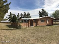 CHECK OUT THIS,  Horse and Cattle lovers DREAM!! 175 Acres with LOTS of Pens, livestock and Truck Scales, big Hay Barn, cement feeders, 3 wells,  1200sf  metal office or cowboy quarters or just storage with a  Bathroom,   B Parcel has 1760 sf Home with brick court yard with  entrace and metal roof,   off a paved road, Corner lot. Once you see it, you will want to stay,  The Opportunities here are endless.
