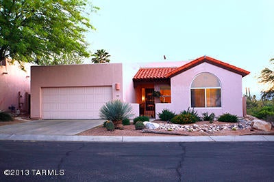This Beautiful Home Is Located In A Serene & Private Location in the Foothills. Spacious Open Floor Plan, Split Plan, Vaulted Ceilings, and Ceiling Fans. Property is Located on a Corner Lot and Backs-up to Natural Desert and a Wash for Extreme Privacy in a Great Location.  Covered Patio to Watch the Desert Wildlife.  The washer and dryer are in ''as is'' condition.
