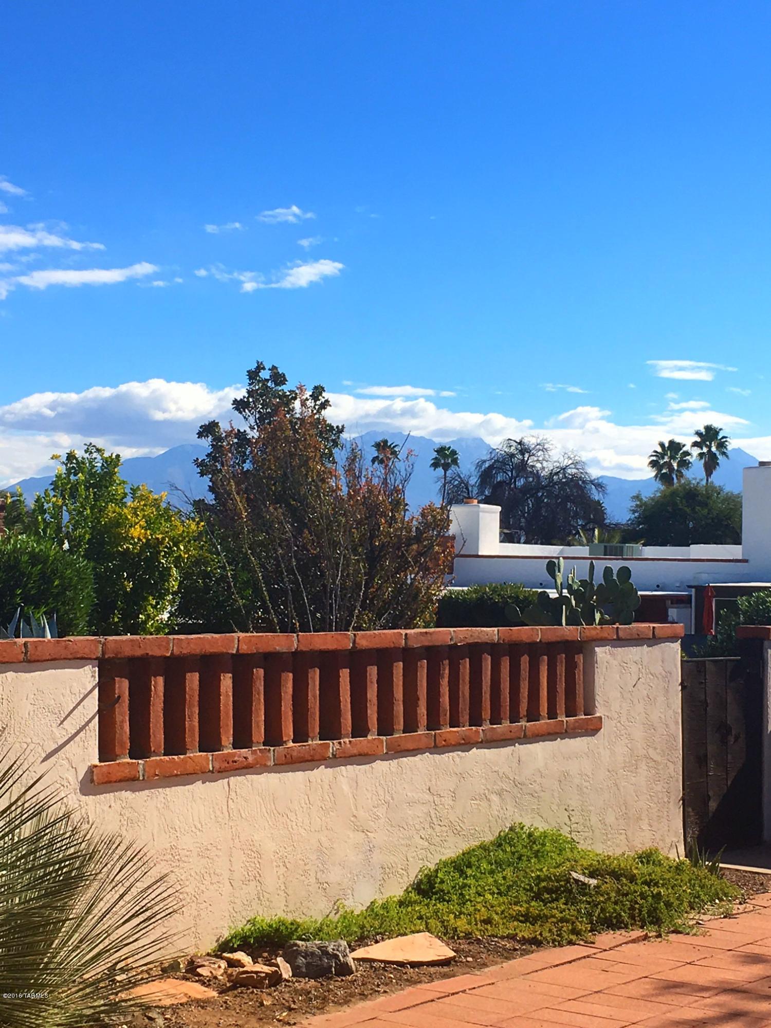 Spacious townhome in the heart of Green Valley. This light an bright home has a large living room for entertaining with a beautiful gas fireplace. A large AZ room that is heated and cooled offers additional space for crafting, a second living area or just a place to enjoy the mountain views! The eat-in kitchen is bright and has plenty of space for meal preparations and a nice amount of cabinet space. With a private front and back patio, you can sit outside and enjoy the AZ weather from dawn to dusk! Don't miss seeing this spacious townhome that is conveniently located near rec centers, shopping and the Farmers Market.