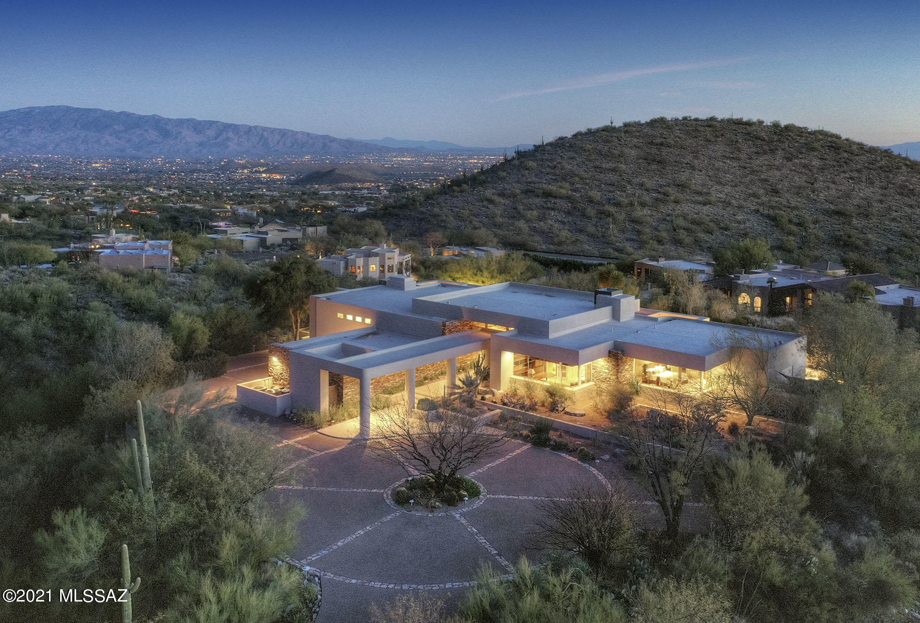 Breathtaking, awe inspiring, unspoiled natural desert - all this & more comes to mind as you tour this phenomenal property. Sitting high up in the desirable Finisterra subdivision, the large lot provides total privacy as you to relax in your negative edge pool & conventional spa. Cooking is a breeze in this bright open gourmet kitchen. Most rooms have ceiling to floor windows allowing for panoramic views and there is potential for a 2nd master or huge guest suite. Gorgeous stacked stone entryway, enormous walk in master closets, green marble master bathroom, polished travertine floors & since we're all spending more time at home, don't miss this opportunity to convert the extra room into your office & upgrade your views with those of the city lights and the Catalina mountains!