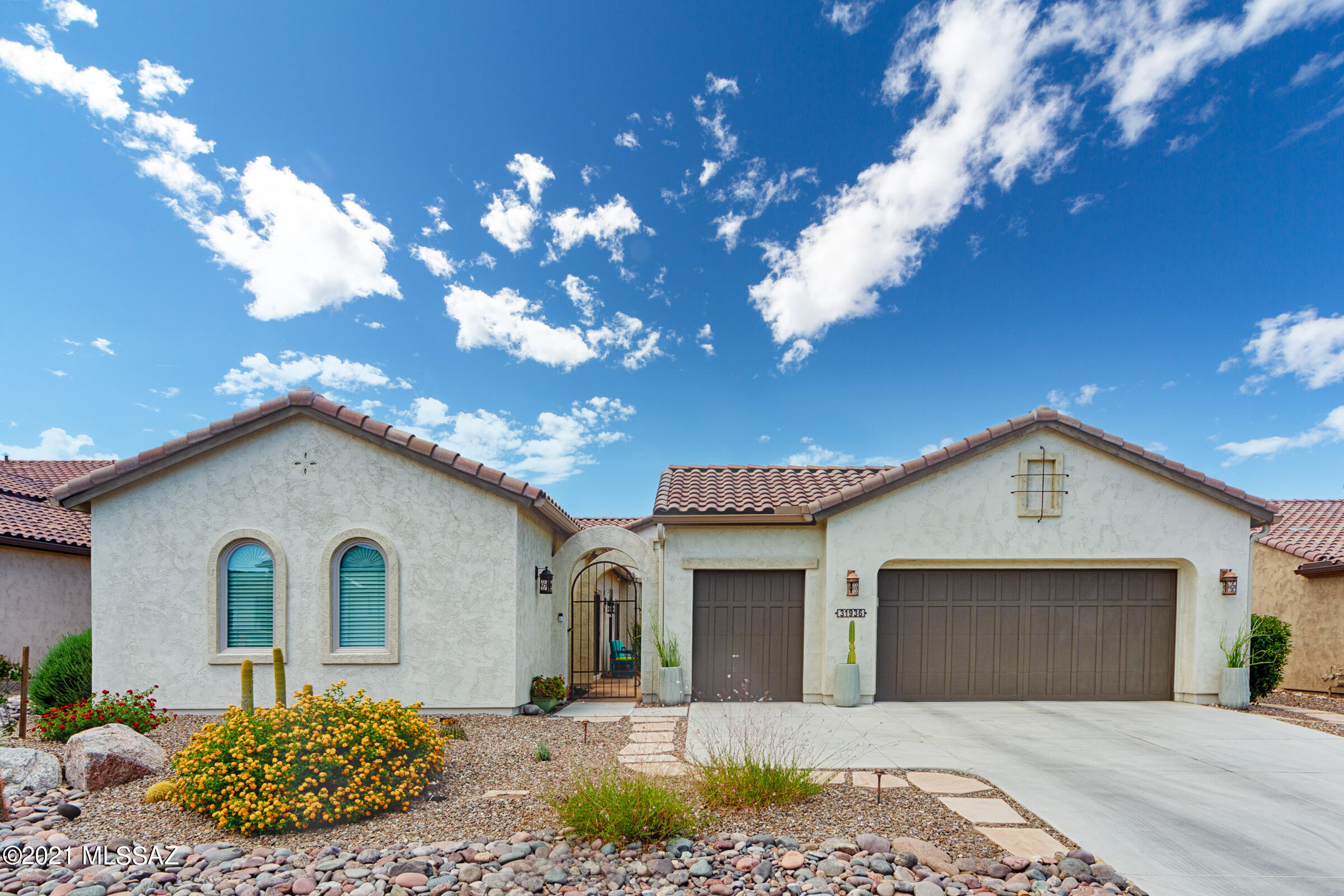 A beautiful Premiere Series Mirasol Exterior Design A located on one of the most desirable streets in SaddleBrooke Ranch.  The home features a Master Bedroom with the optional Bay Window extension and attached Master Bathroom w/dual sinks, vanity, shower, tub, and large walk-in closet; a 2nd Bedroom w/attached  full bathroom; a Den/Office with built in wall unit that has two-murphy beds in it; Powder Room; Laundry Room w/sink; Large Kitchen w/Center Island; Great Room that includes Dining Area; an incredible full Bar that faces the Great Room w/sit-up capabilities; a very large outdoor Covered Living Space; 2-car garage with attached Golf Cart Garage; a very large and sheltered front Courtyard w/gate, and to top it all off – the owner added a separate Casita that is ~281 sq. ft. w/attach the owner added a separate Casita that is ~281 sq. ft. w/attached full bathroom that is located in the front of the house. There are ceiling fans in the Great Room, Master Bedroom, Bedroom #2, Den, Casitas, and outside covered patio. The floors in the home are real maple hardwood floors. There is a BBQ island in the back yard with a highly upgraded BBQ and accessories.  The is a "PAID FOR" Solar System making the electric payments out to an average of just $25 a month. There is also an Kinetico Water Filtration and Softening system in the garage.  Both the front and back yards are meticulously landscaped w/blooming flowers, and the irrigation system was just completely re-done! The large front yard and expansive backyard that has incredible views of the 10th Fairway and the Tortilita Mountains compliments this home even more but let us not forget the incredible sunsets off the back that makes this home a true find for the discriminating buyer.