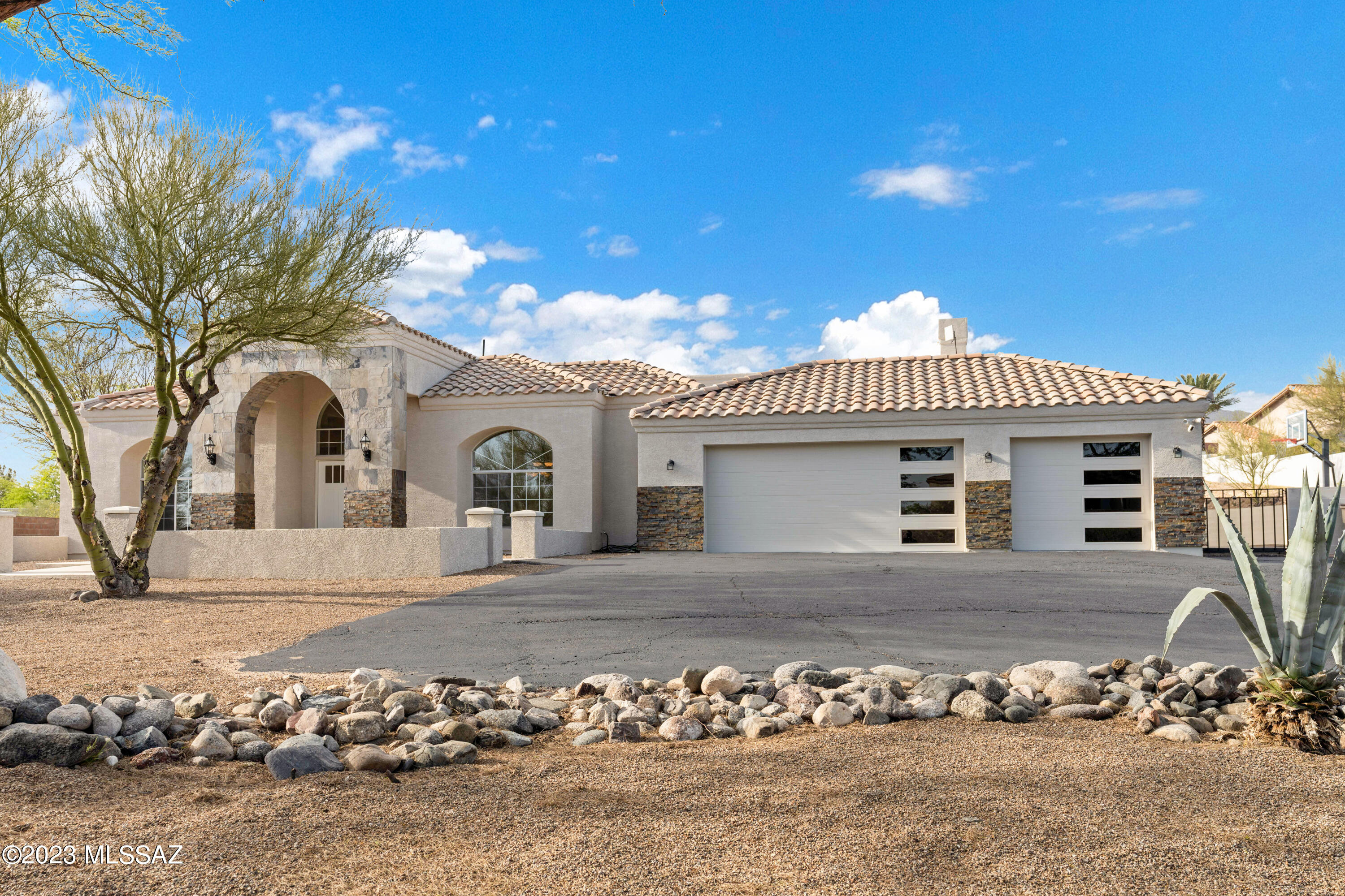 PRICED TO SELL Fully Custom home located on 1 acre in Foothills Estate NO.7  . Property has it all with a brand new custom gourmet kitchen that includes, a huge island, custom cabinets and quartz throughout.  Kitchen leads into a great room with soaring ceilings, Versailles pattern tumbled travertine floors, glorious stacked stone fireplace and custom shelving (Buyer to decide on stain color). Kichler lighting is throughout this house. All 3 baths were remodeled with custom slate and stone flooring. Large master bedroom leads into a 5 star bath with pass-through Gas fireplace, Jacuzzi Tub, custom knotty Alder vanity, Barn doors, and a custom stone shower! Home offers an in-law suite with full bath and access to the porch.  Desired Cat Foothills location w/ great sunset and mountain view Seller is Owner/Agent