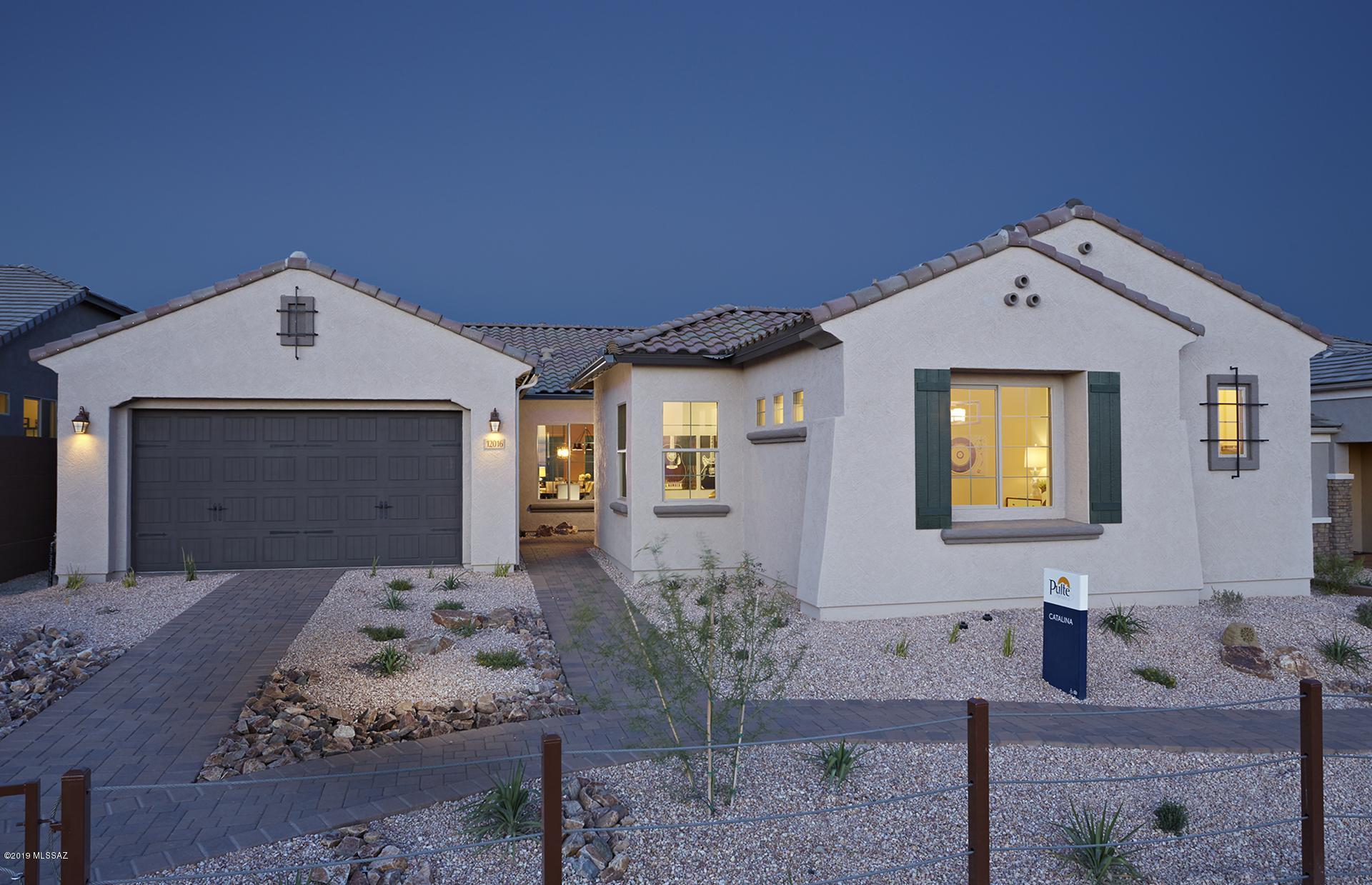 This Catalina home design is a former model at Tangerine Ridge which features guest suite with living area, faces East back yard, elevation A exterior appearance, upgraded Cherry Java cabinets, upgraded flooring with 12x24 tile, stainless steel appliance, chef kitchen, frame walk in shower in master bath and much more.