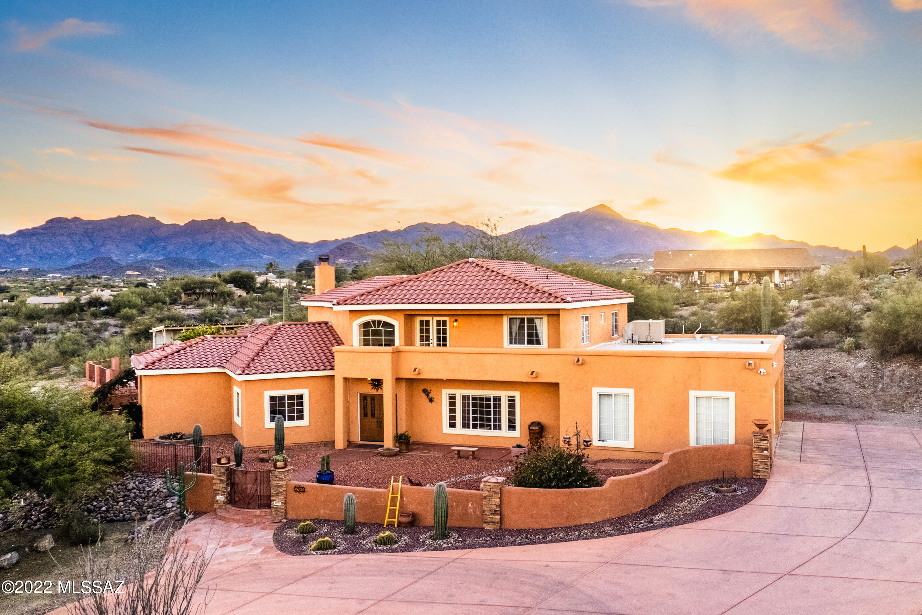 Original owner offers a one of a kind home with heated pool, spa and amazing Tucson views. This custom build home has beautiful upgrades throughout the entire home. Enjoy sunrises from East facing balcony and sunsets from the privacy of your very own pool/spa. With a 3 car garage and RV carport you shall have no problem storing your toys and RV. Master bedroom in main floor complete with soaker tub, walk in shower, huge walk in closet and access to the patio. Kitchen has been fully upgraded with custom cabinets, granite counters and black stainless steel appliances. Plenty of space to entertain both indoors and outdoors. Second story offers a loft and two balconies to enjoy the views. Refrigerator, mounted tvs, potted plants, outdoor furniture and art do not convey.