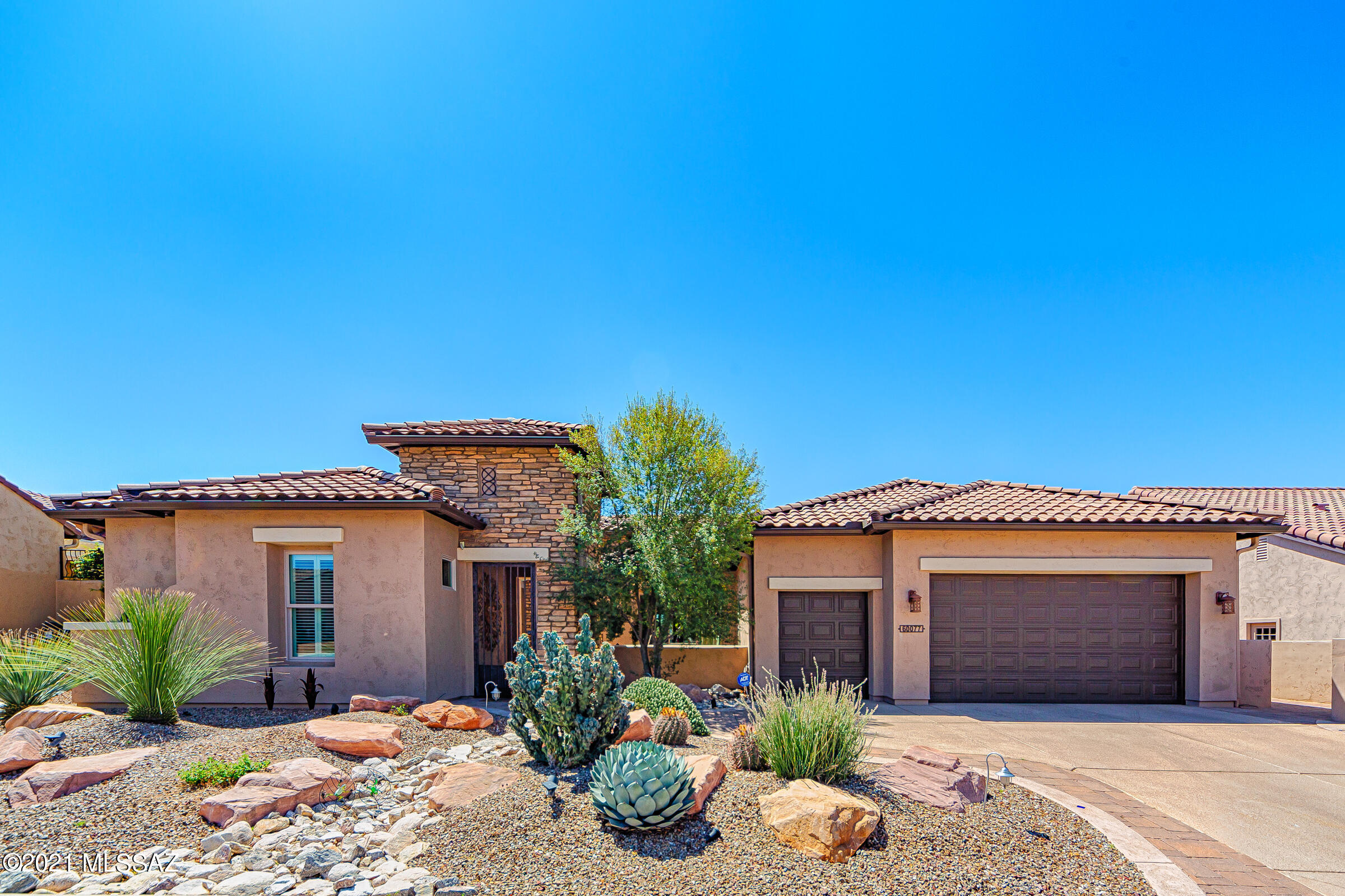 ONE OF THE FINEST COMBINED GOLF COURSE/CATALINA MOUNTAIN VIEWS IN SADDLEBROOK RANCH.  This south-facing, SPECTACULAR, highly upgraded Brisa model (2905 sq ft)  is just waiting for you..  CASITA with private entrance and bathroom can be used for guests or an activity room.  Two OUTDOOR FIREPLACES (court yard and patio) complimented by built-in bbq.  Home boasts formal & informal living and dining areas.  Open KITCHEN has expansive breakfast bar, island, designer granite counter tops & upgraded stainless appliances with adjoining Great Room all with tasteful finishes.  Private den/office/bdrm.  Master Suite is expansive with door on to extended paver patios.  Bathrooms have custom finishes, dual sinks, soaking tub & walk-in shower.  This is luxury living!